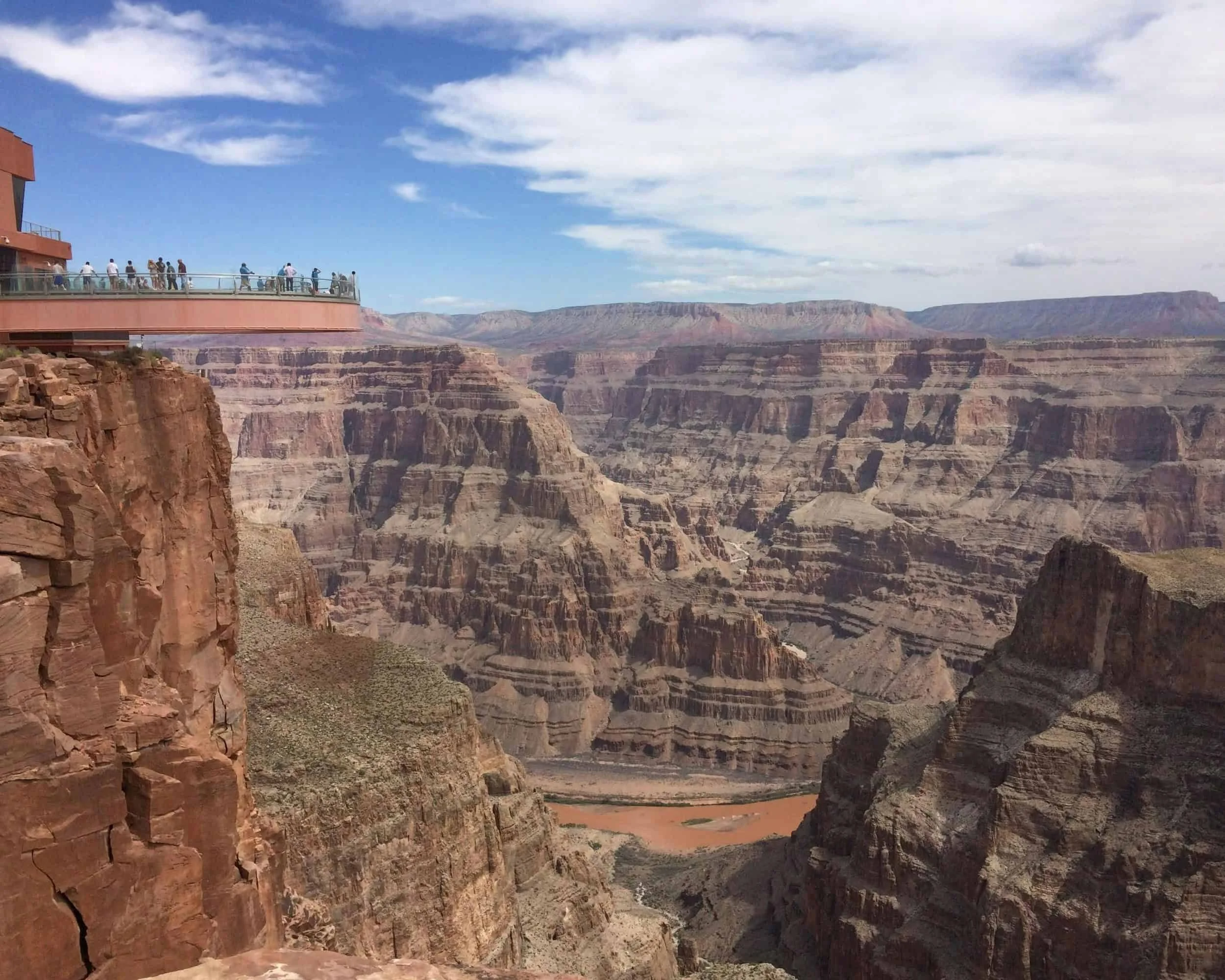 Visitors on the Grand Canyon West Rim Skywalk, reachable by bus tour from Las Vegas.