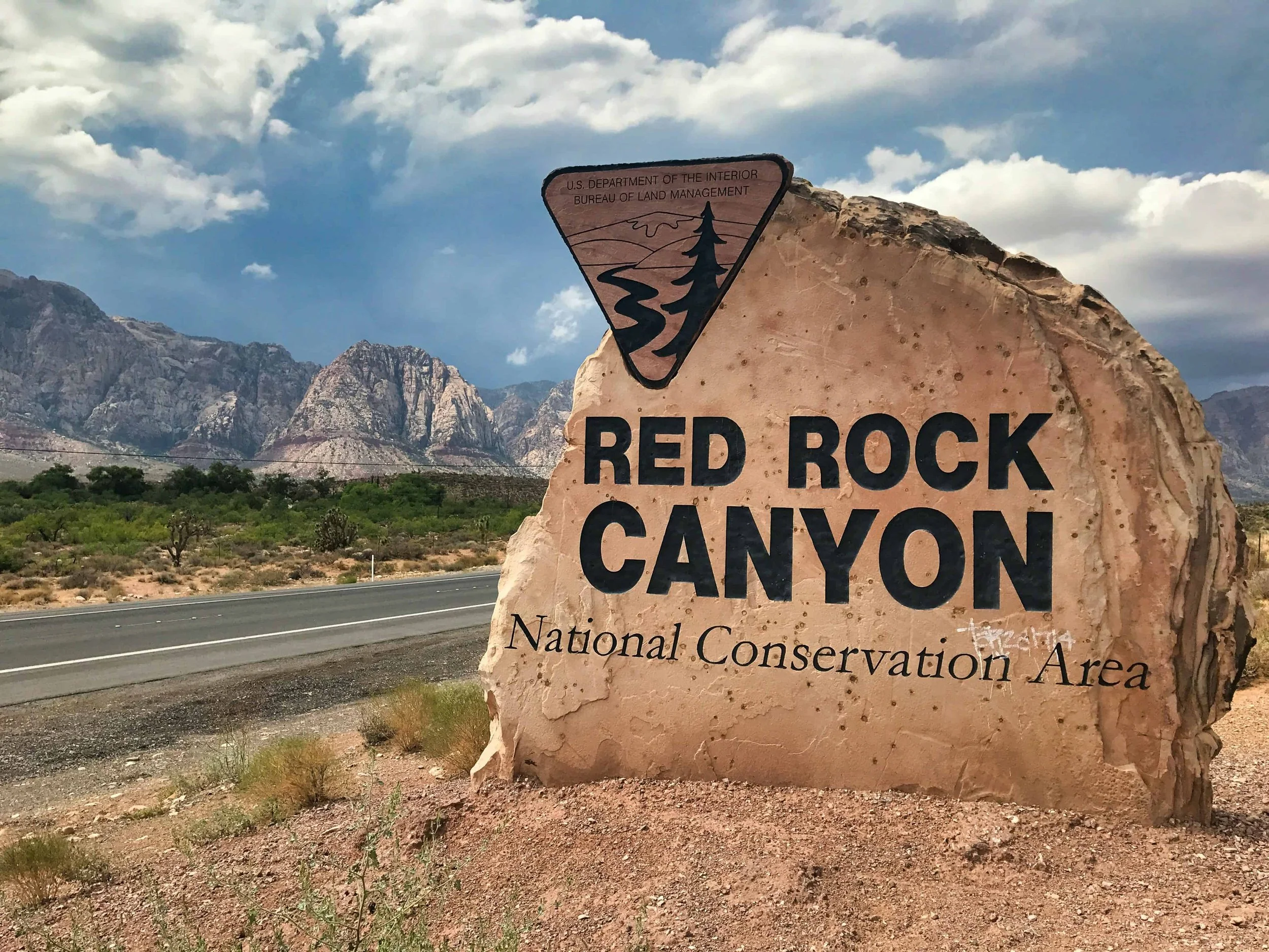 Red Rock Canyon National Conservation Area entrance sign near Las Vegas — a top day trip from Las Vegas for families with teens.