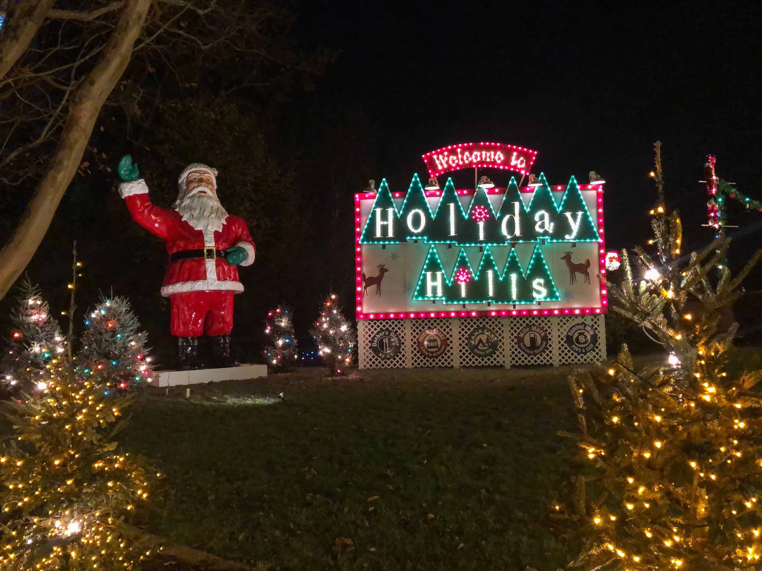 A large Santa Claus statue welcomes guests to Holiday Hills near Italy & Festa Italia during Christmas Town at Busch Gardens Williamsburg