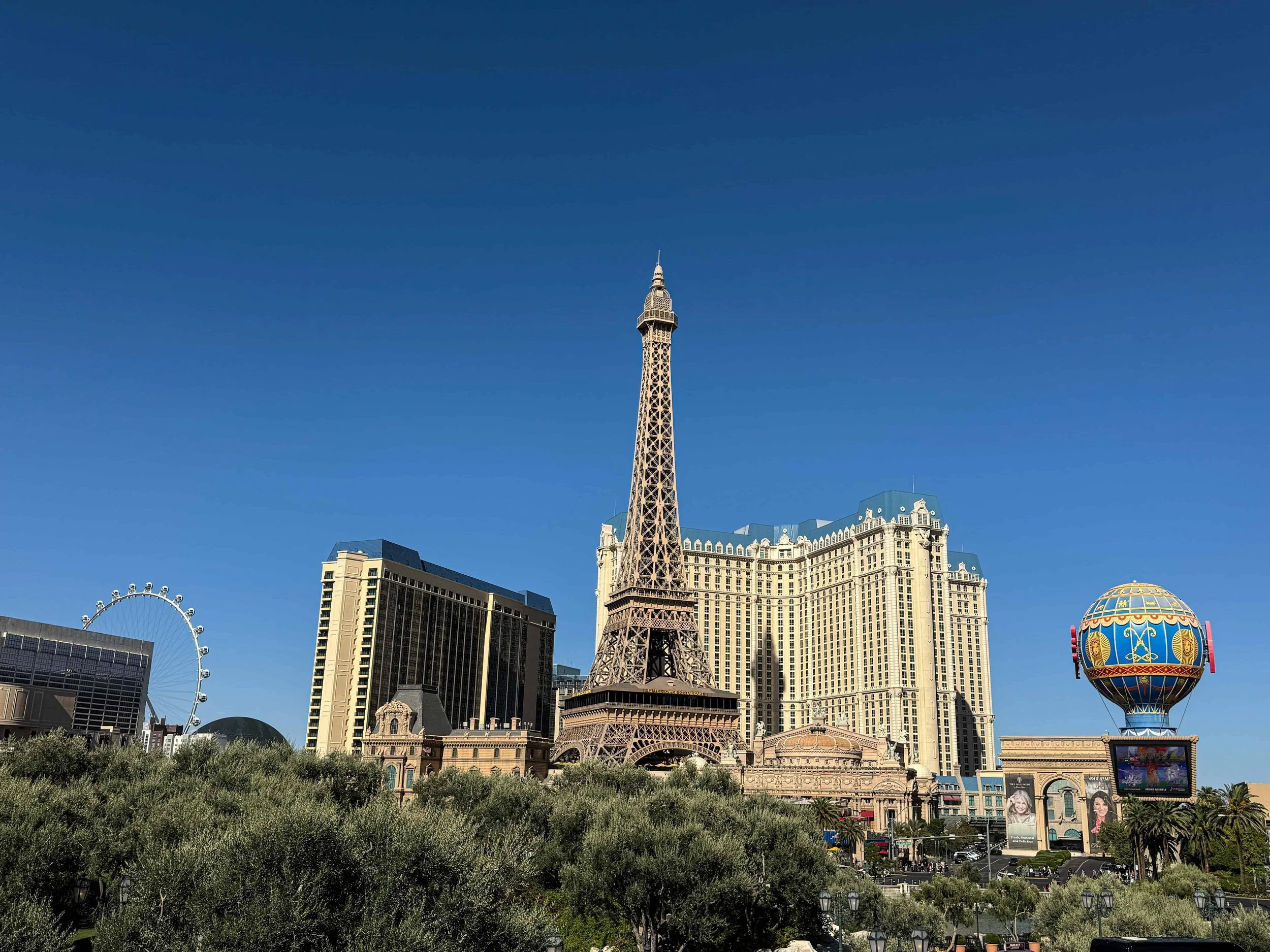 Paris Hotel Eiffel Tower replica and High Roller observation wheel on the Las Vegas Strip — iconic landmarks teens recognize instantly.