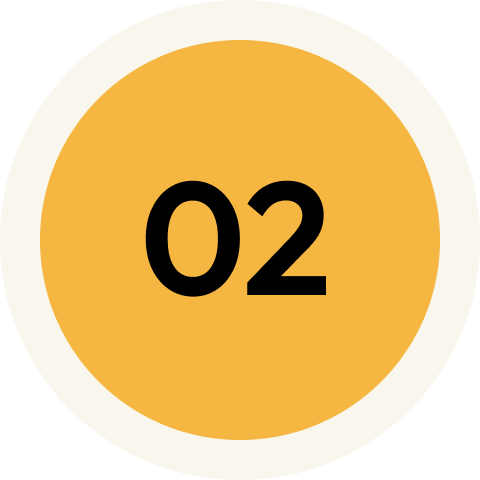 A circular badge with a white border, a yellow-orange background, and the number "02" in black in the center.