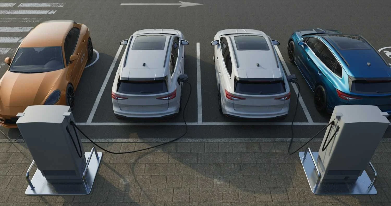 A lineup of electric cars all plugged into public chargers
