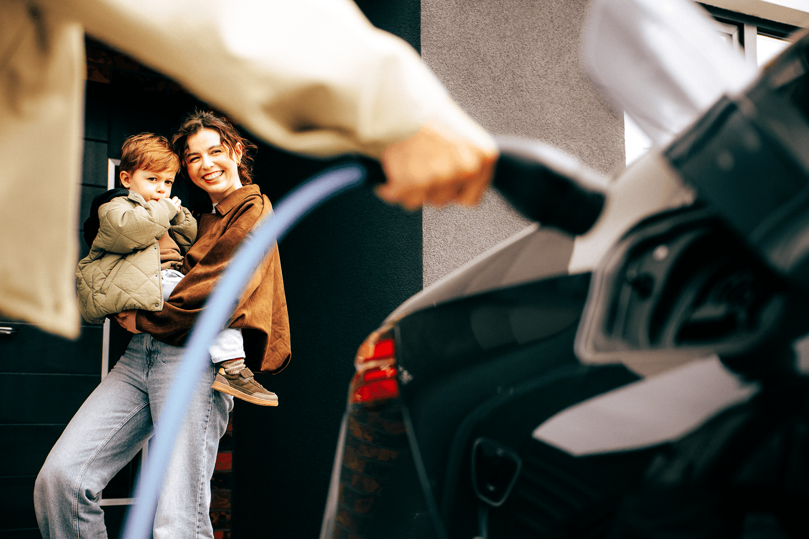 Lady and child with electric car