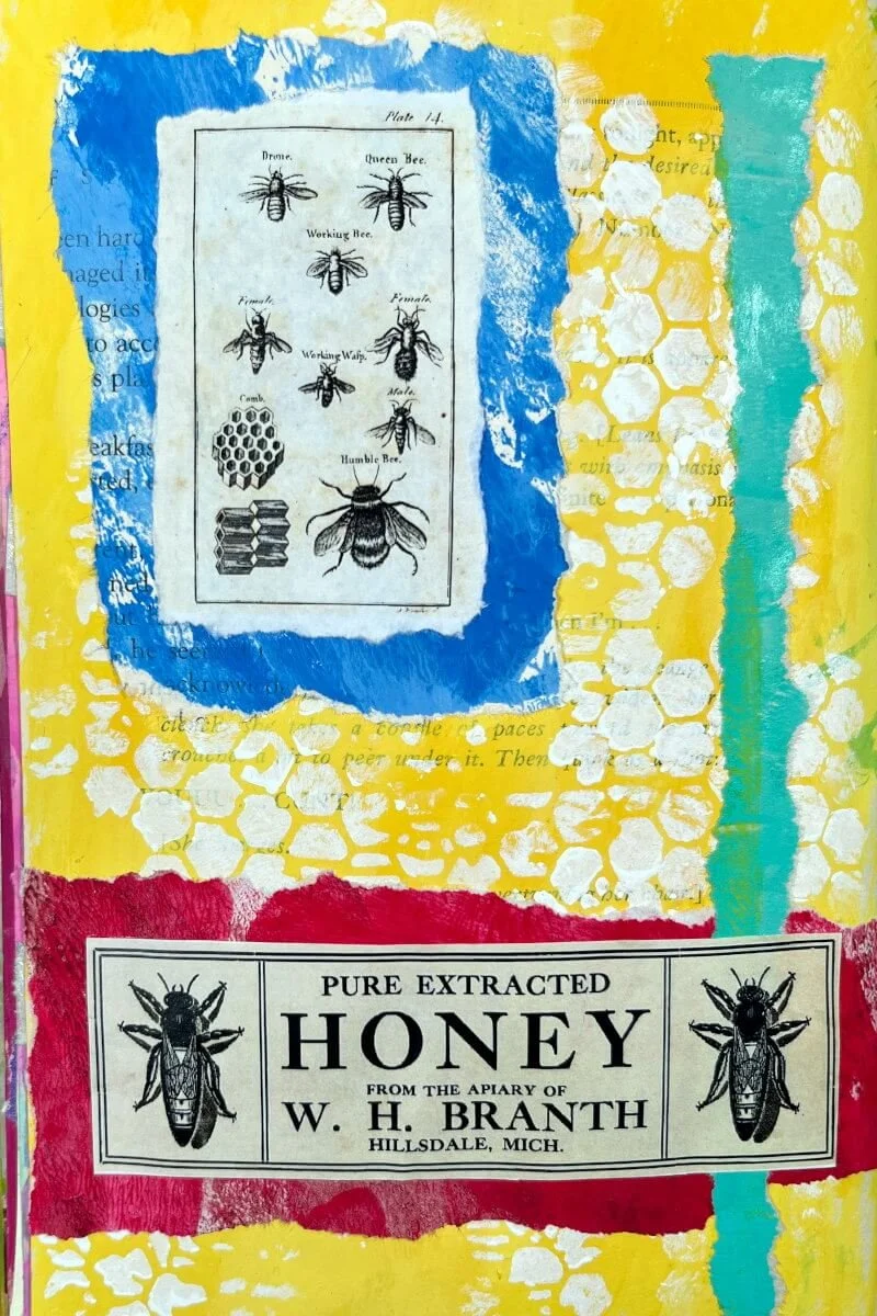 An art journal page made using a vintage honey label