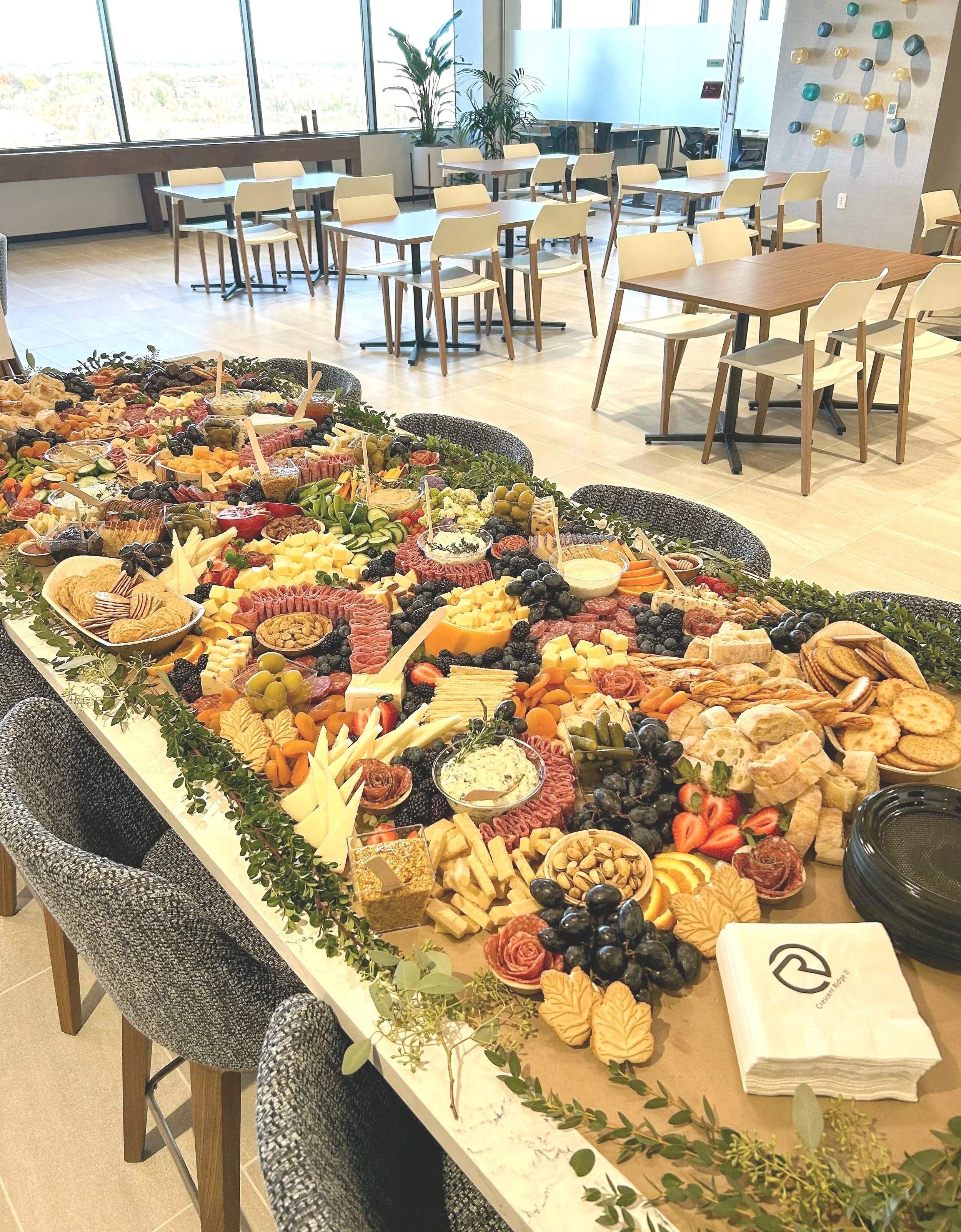 a large graze table filled with charcuterie and artfully arranged for a corporate event in plymouth, MN.