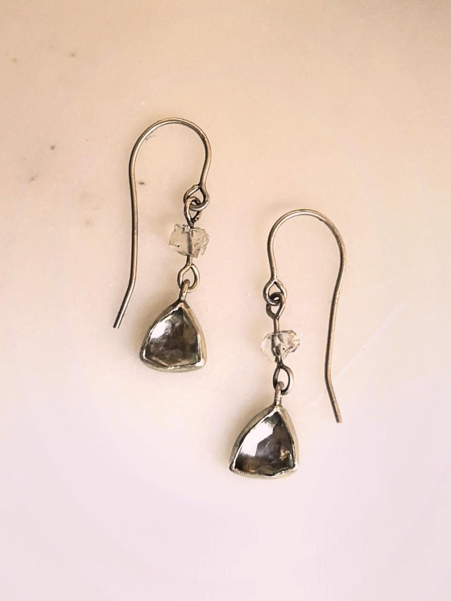 Delicate triangular Aquamarine gemstones with just a whisper of blue are paired with sparkling Herkimer diamonds. Their soft, subtle color makes these earrings endlessly versatile &mdash; an elegant touch that complements everything from everyday wea