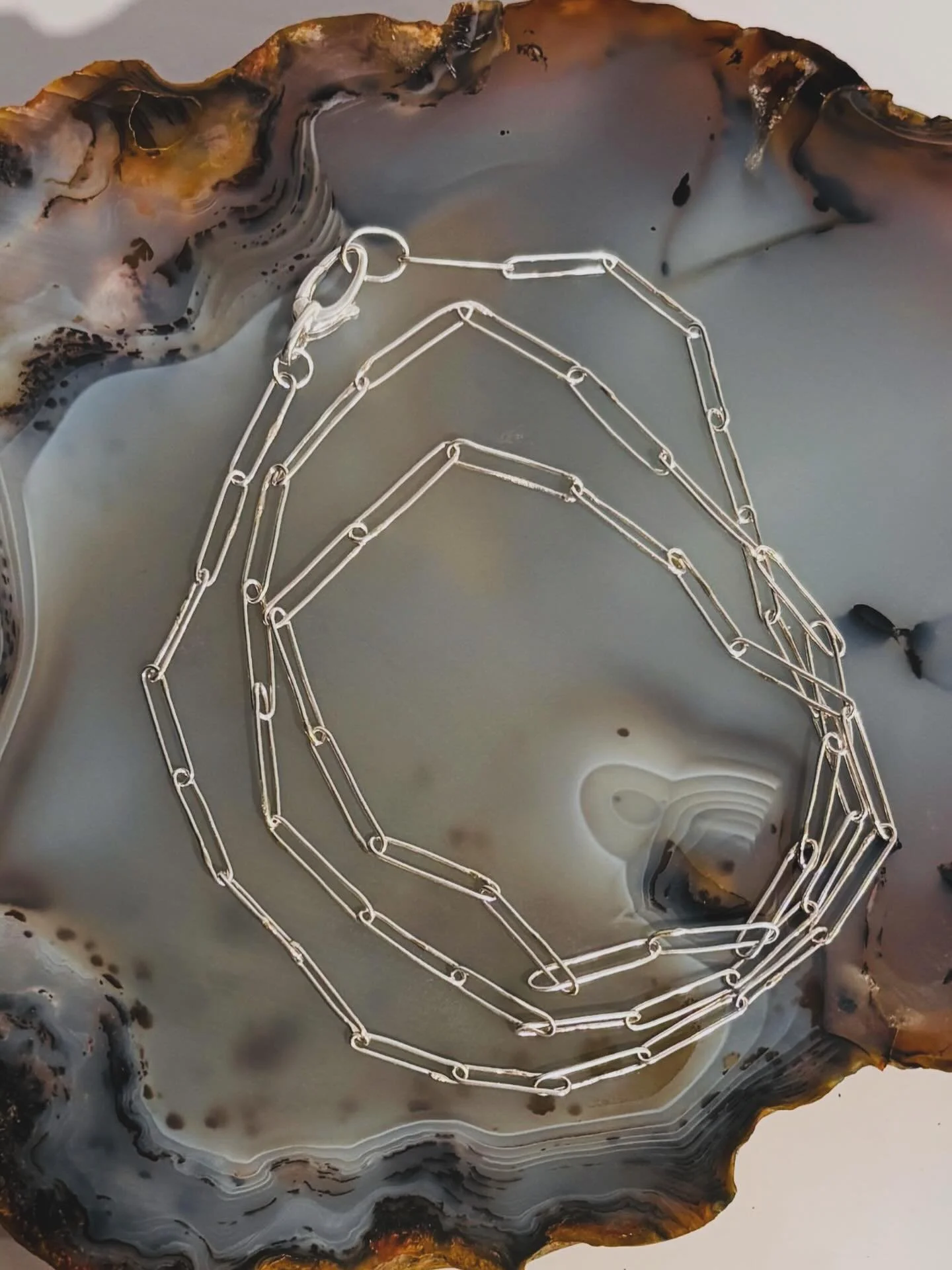 There&rsquo;s something effortlessly cool about a handcrafted silver paperclip chain&mdash;clean lines, modern feel, and just the right amount of edge.

It&rsquo;s the kind of piece you reach for every day&hellip; perfect on its own for a simple, und