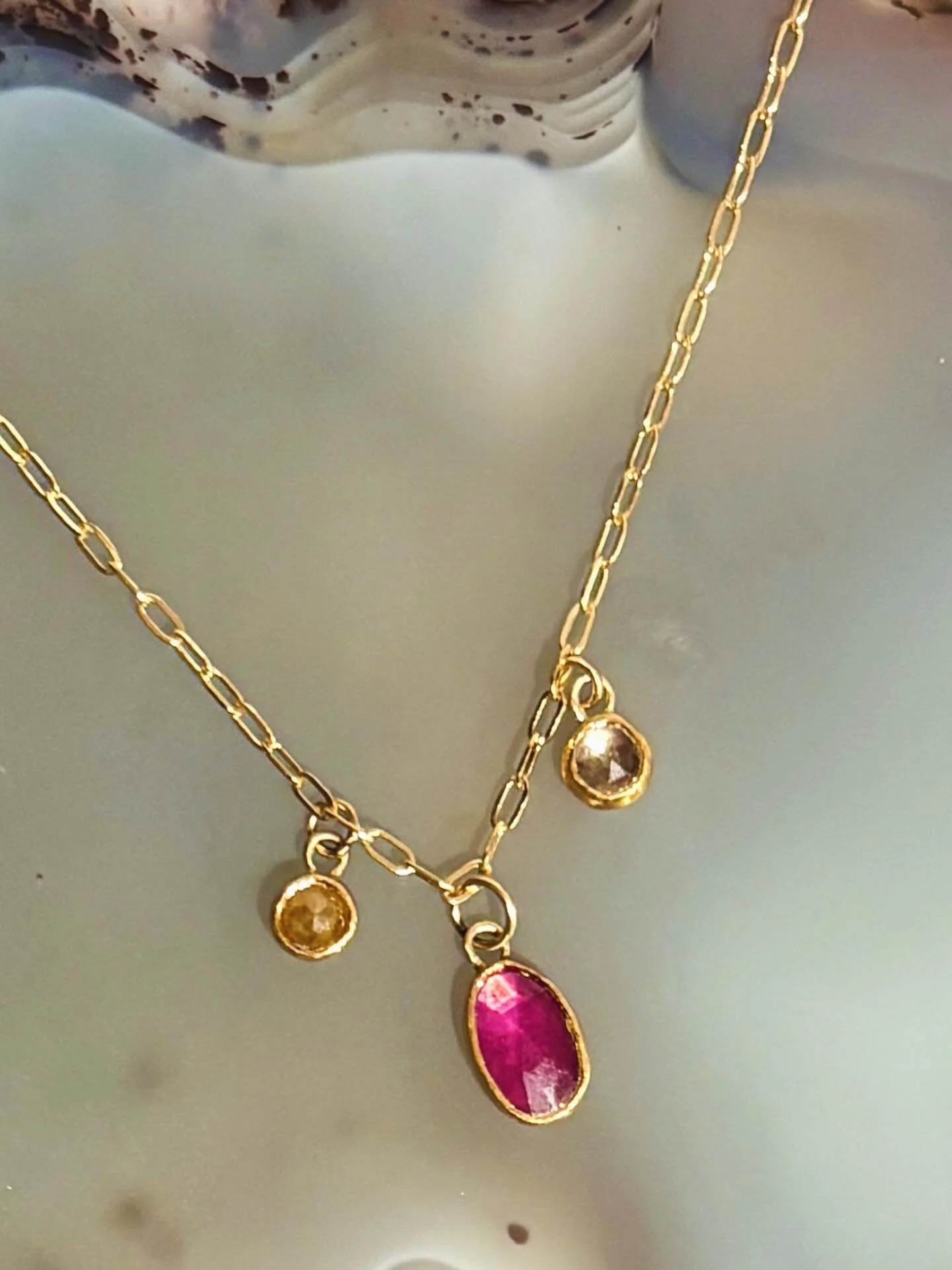 A piece that quietly holds a whole story close to the heart.

This handcrafted mother&rsquo;s necklace brings together the soft, nurturing glow of pink tourmaline&mdash;her birthstone&mdash;with the warm sparkle of yellow diamond and the crisp light 