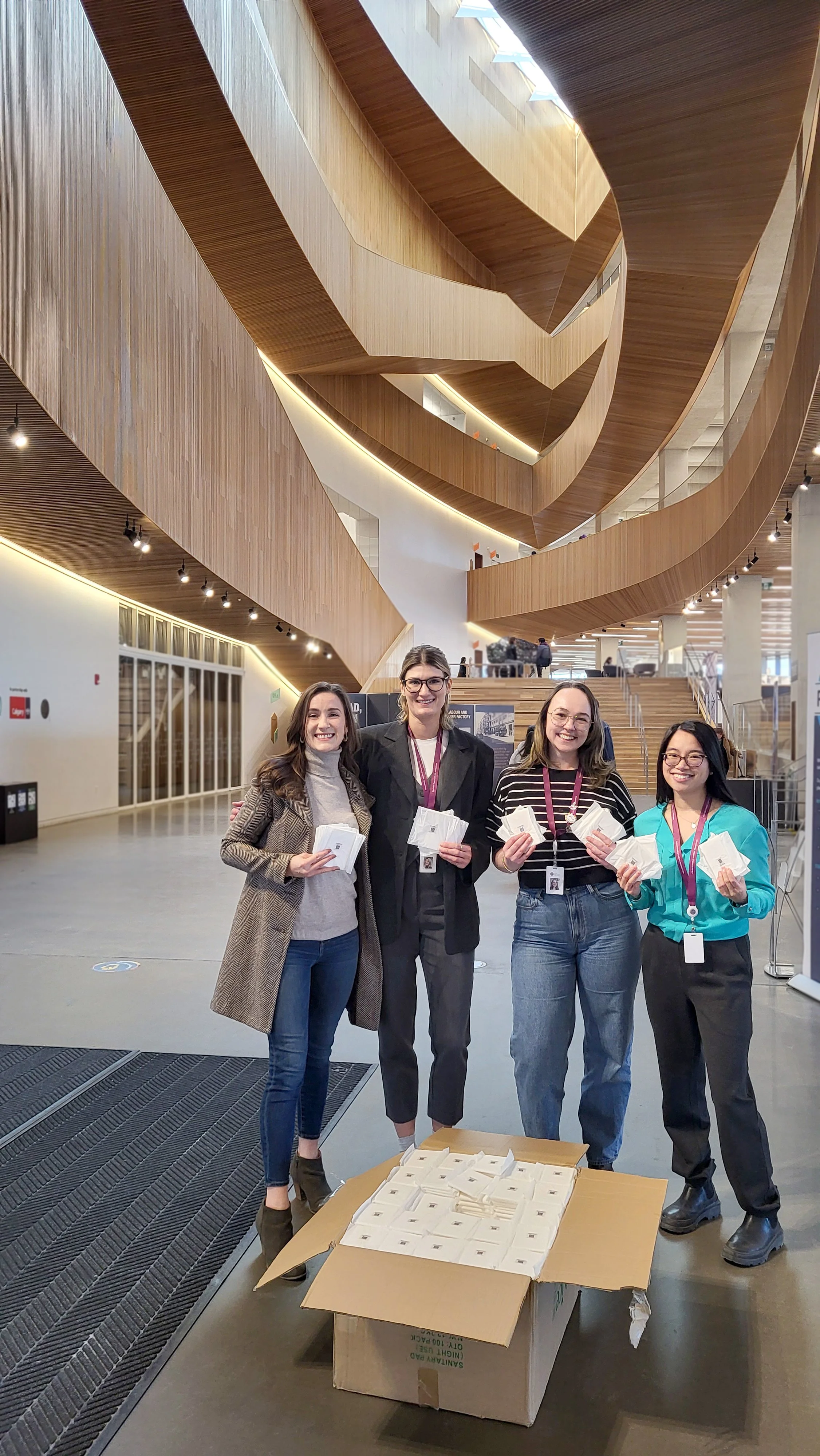 Rachel of Sacred Bloom donating 1000 organic pads to the Calgary Public Library - Free. Period. Initiative in January 2026