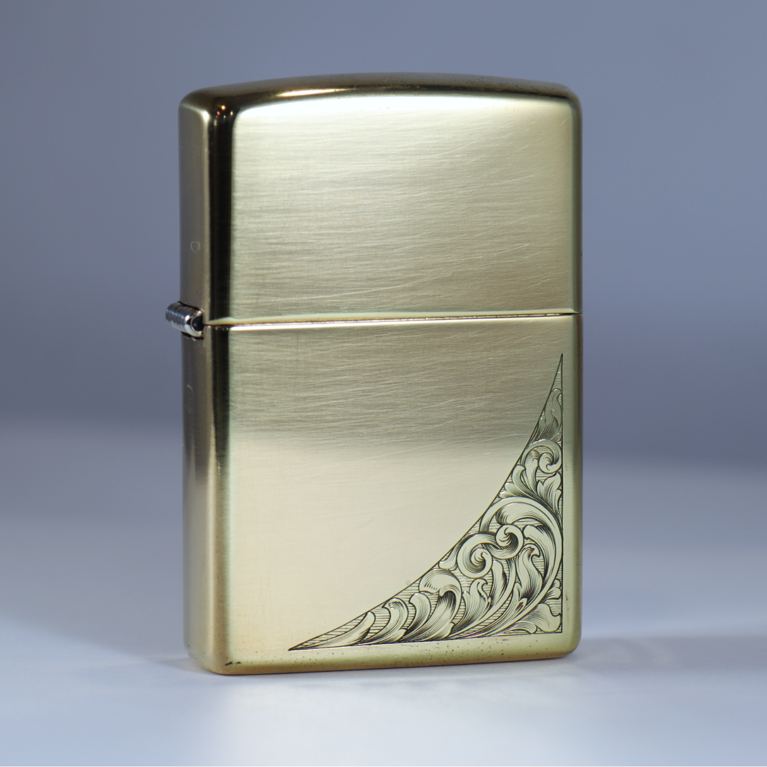 Engraved Brass Zippo Lighter on a white background