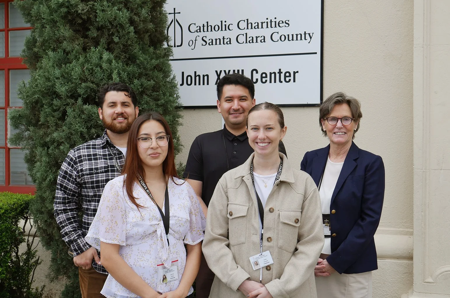 Staff from The Window in front of the John XIII Center.
