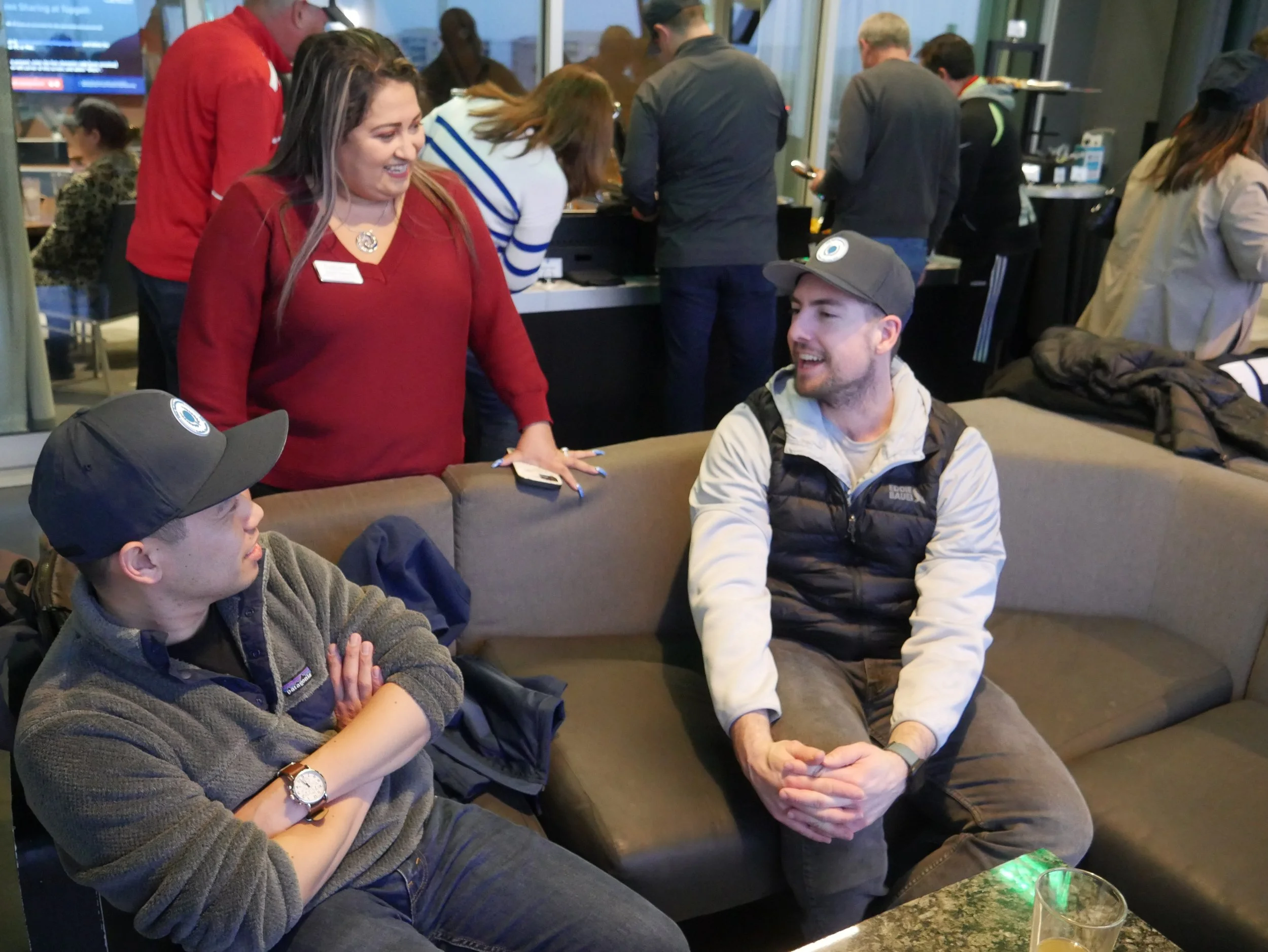 Group of attendees chatting during the event.