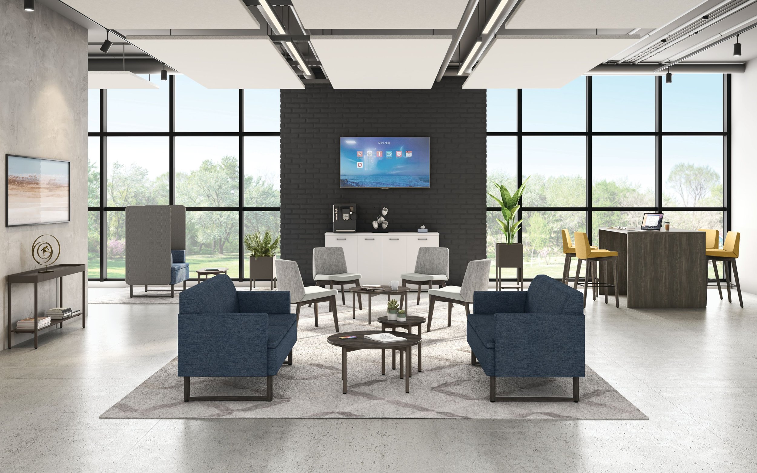 Modern office lounge with large windows, blue sofas, white chairs, coffee tables, and a coffee maker, with a view of trees outside.