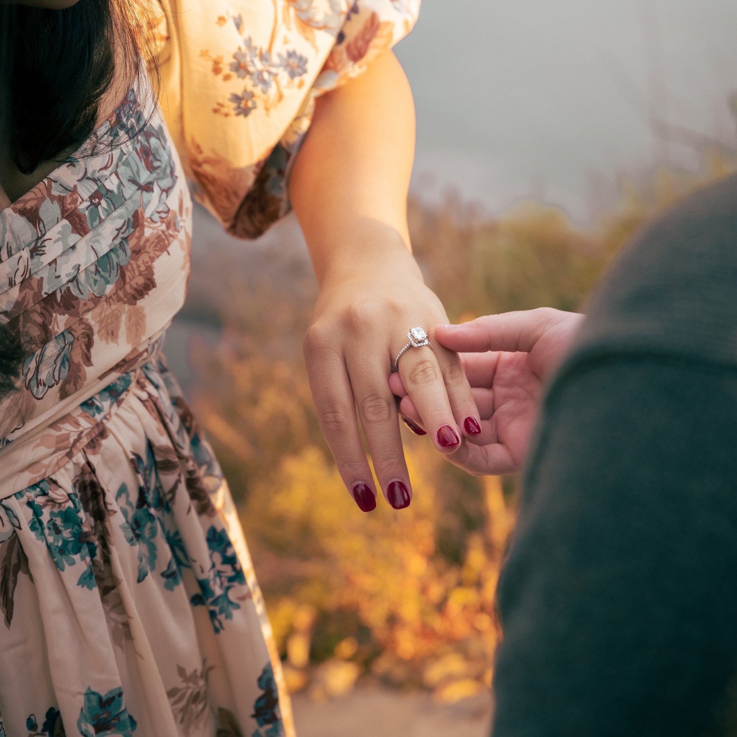 a couple admiring their engagement ring right after he proposed.jpg