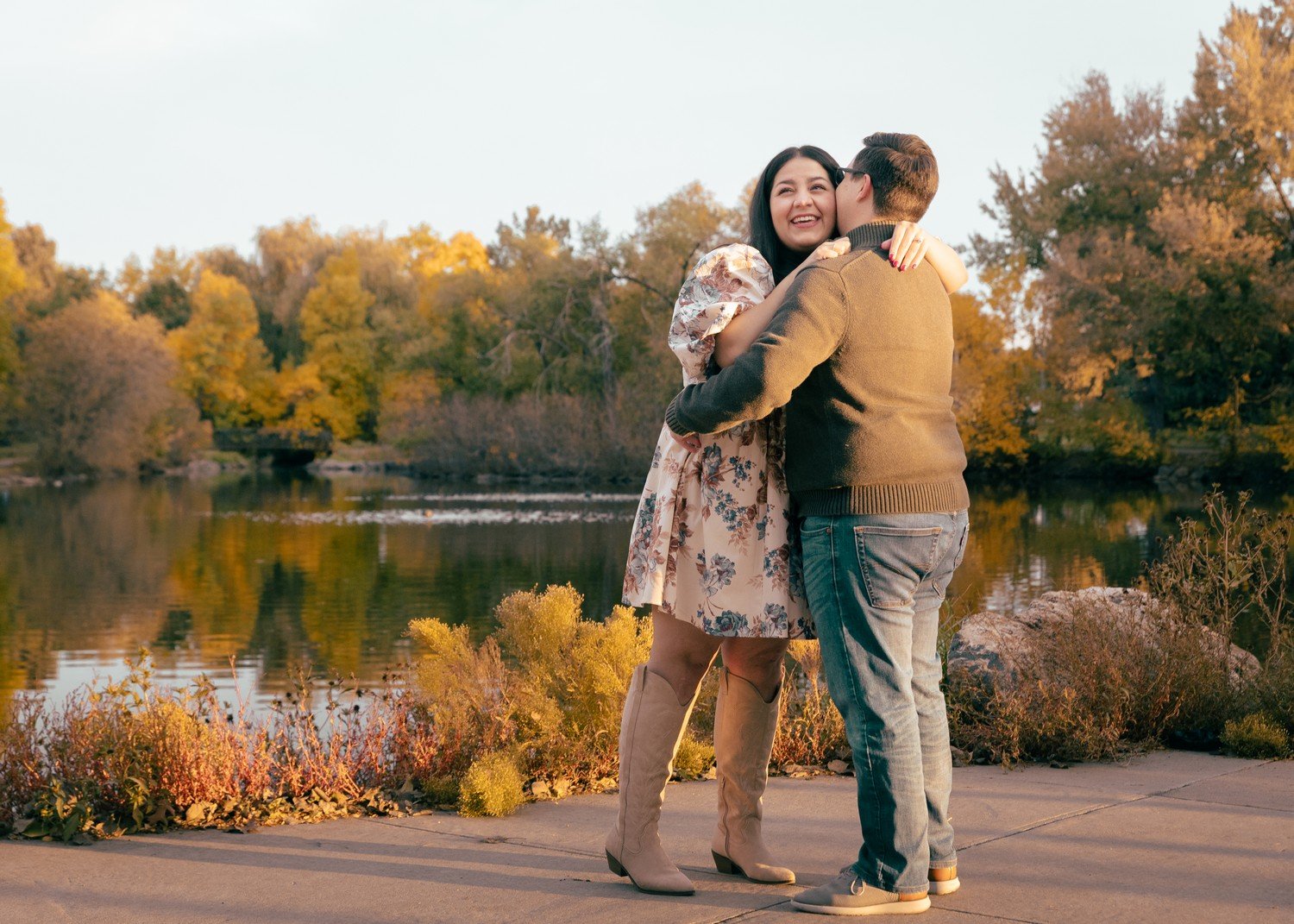 a couple hugging right after getting engaged at Sterne Park.jpg