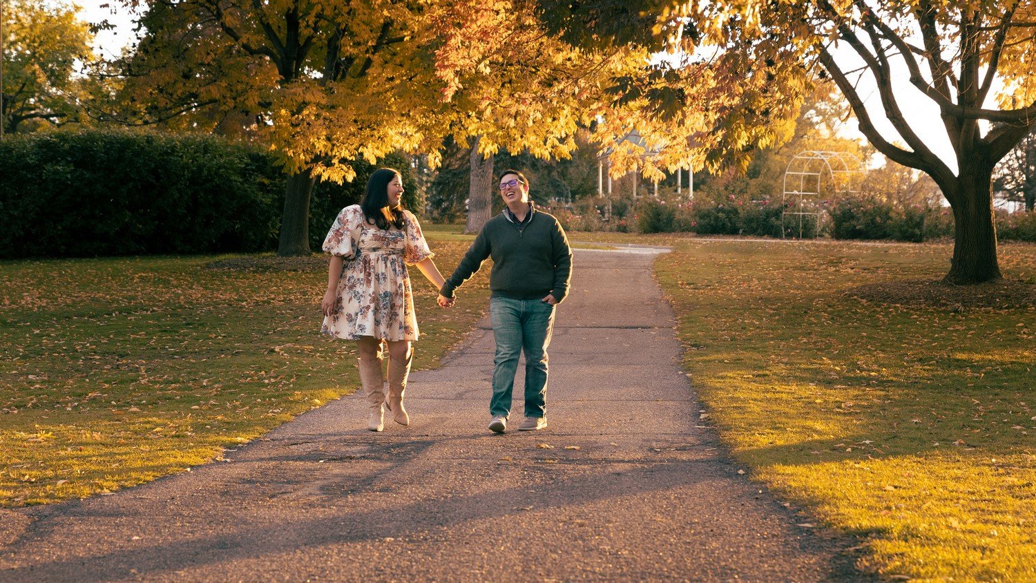 a cute couple walking through sterne park with beautiful fall colored leaves.jpg