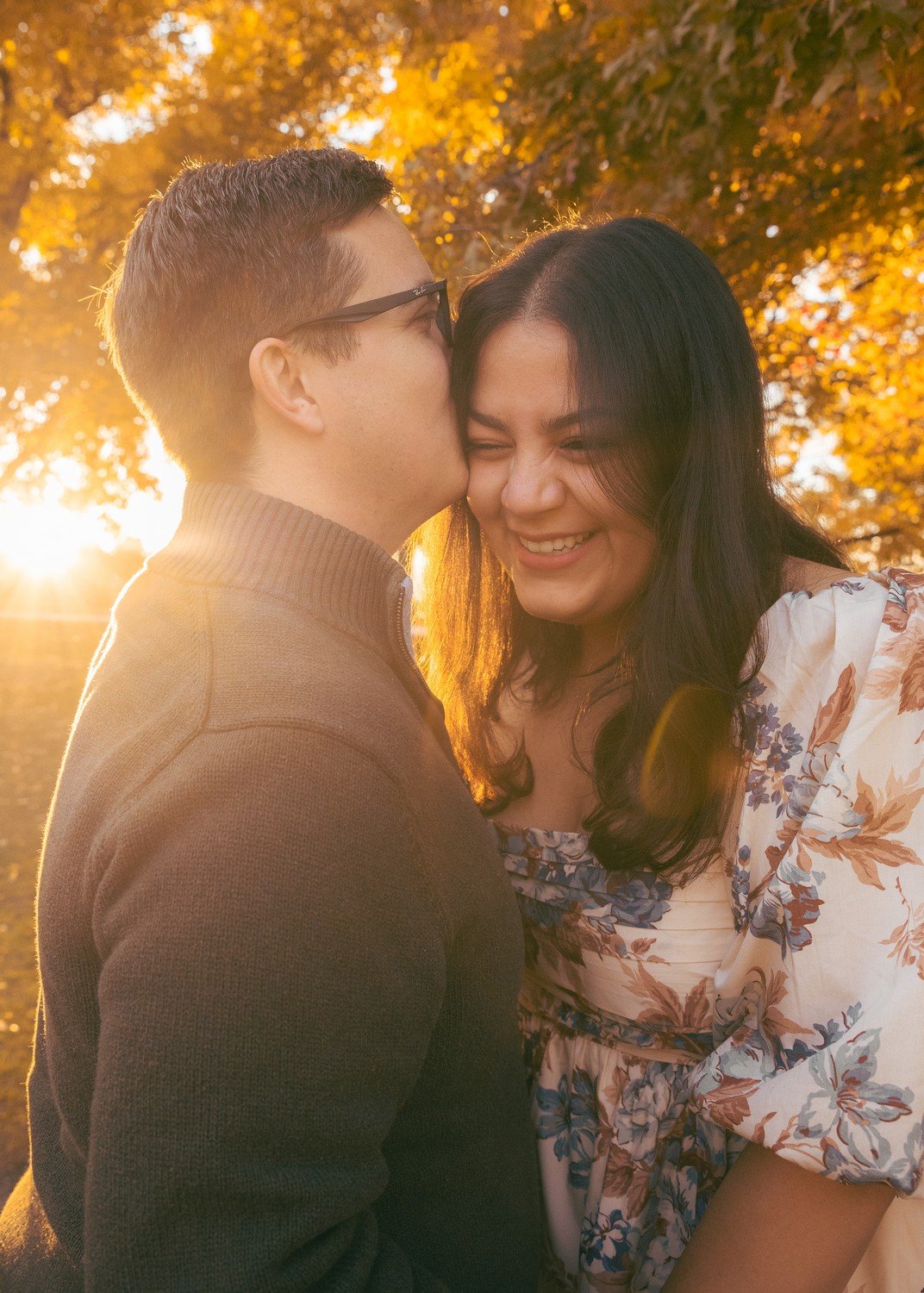 a man kissing his new fiances cheek in littleton.jpg