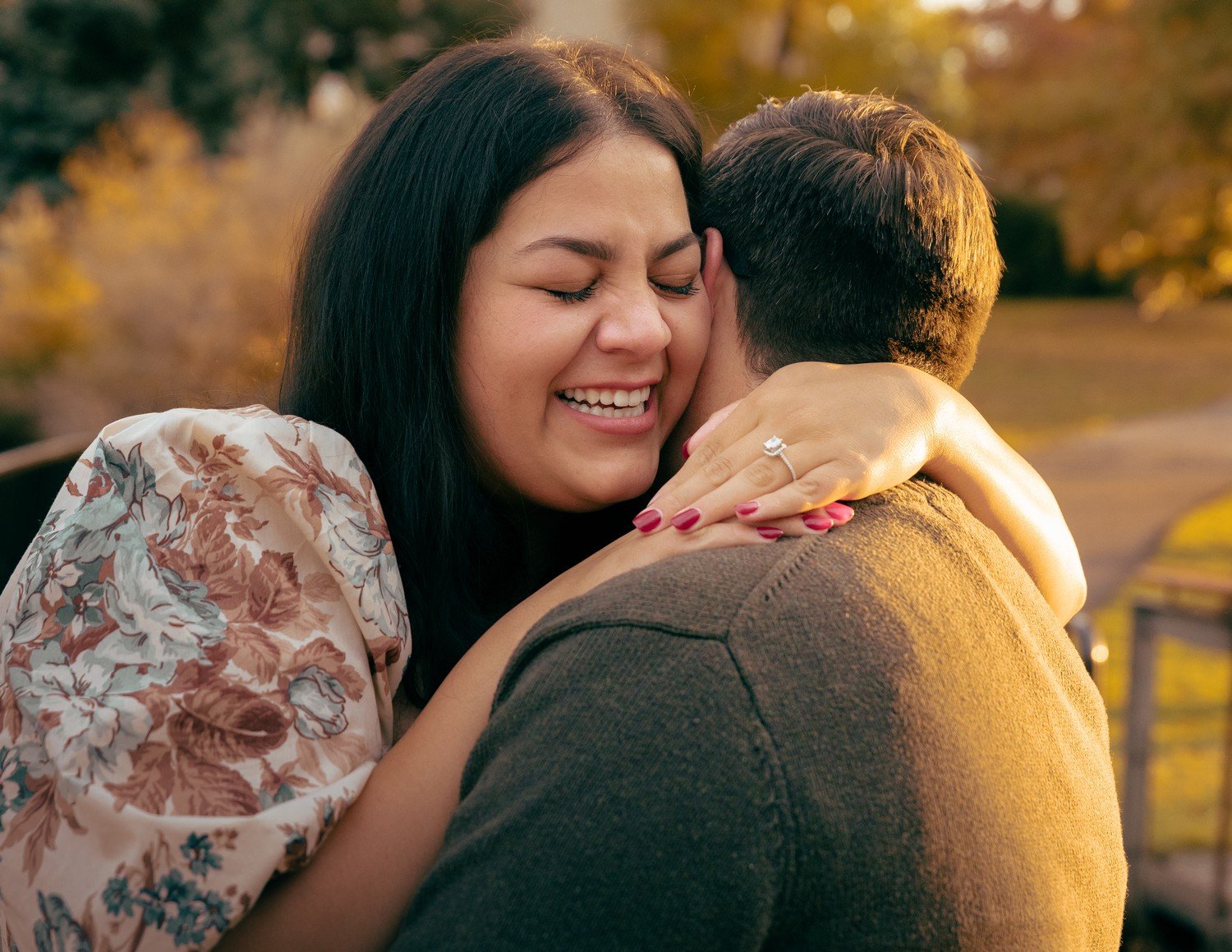 an engaged couple hugging at sterne park.jpg