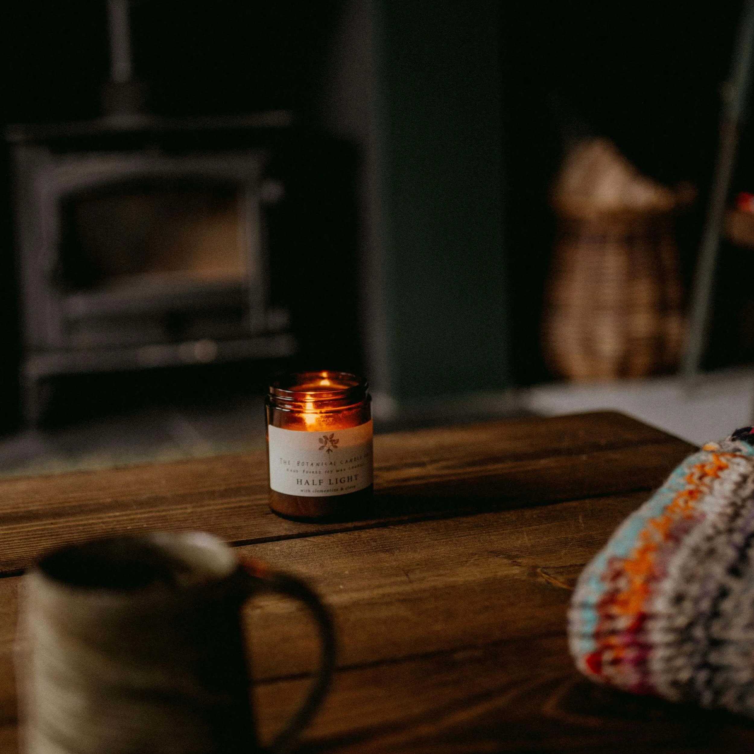 a candle in a cozy cabin
