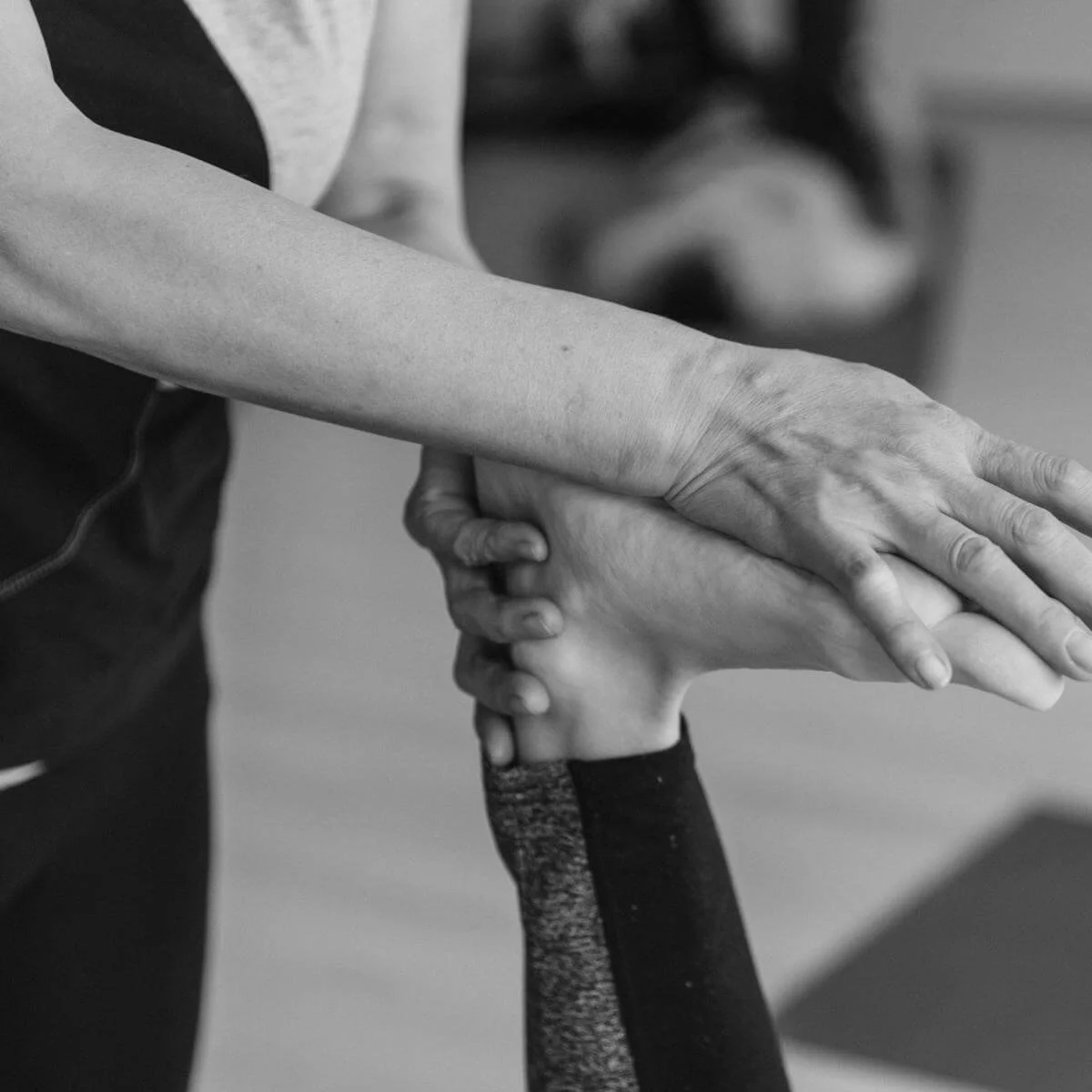 a physical therapist helping someone stretch