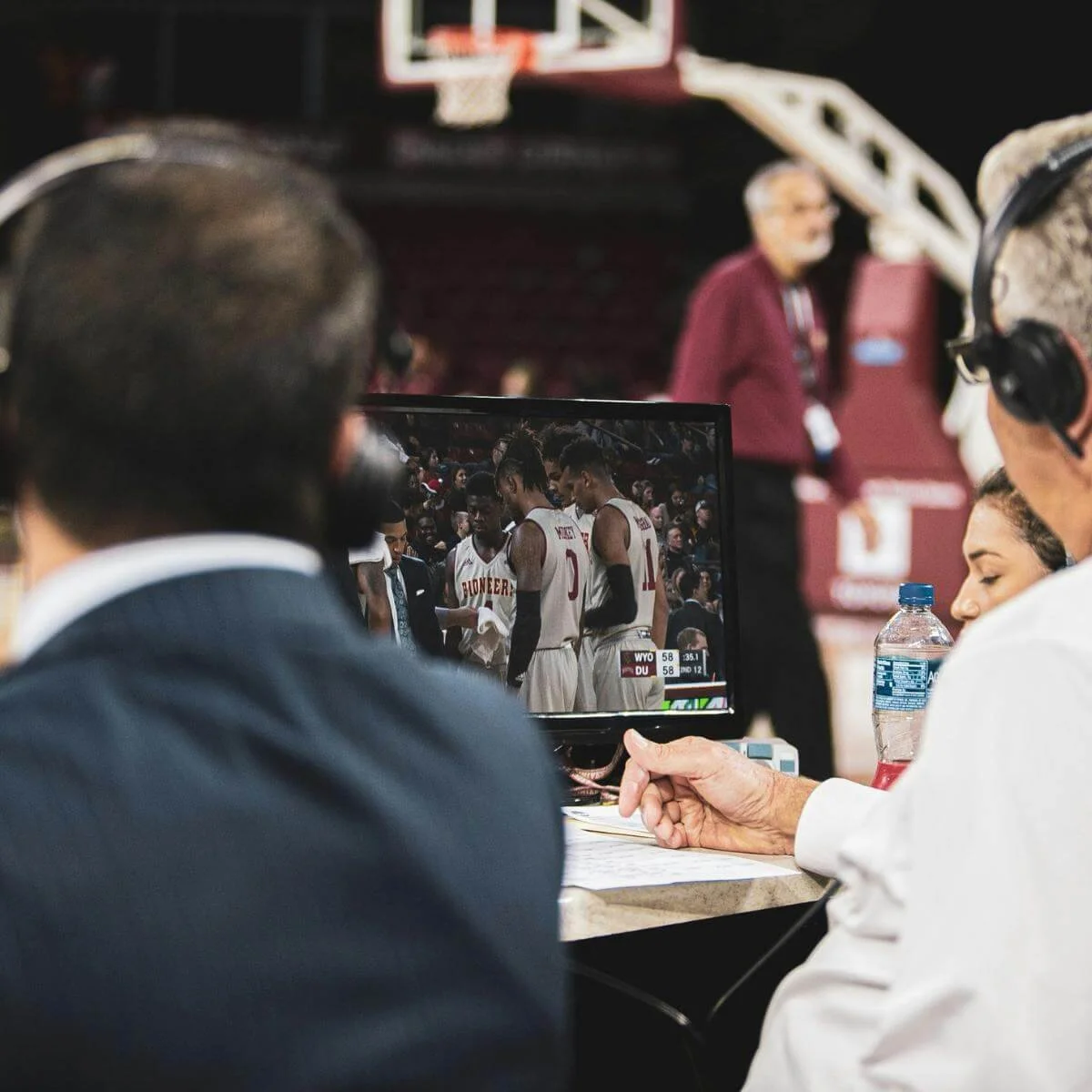 Commentators for a college basketball game