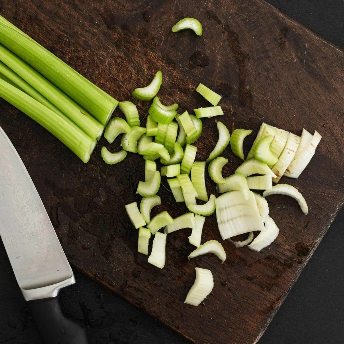 chopped celery on a cutting board