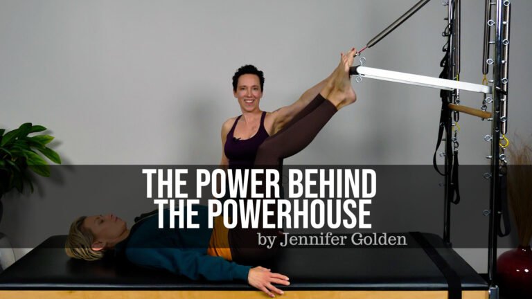 Jennifer Golden is lying on a Pilates reformer bed with her legs raised, holding a bar attached to resistance cables. There is a large plant in the background and text overlay reading "The Power Behind the Powerhouse by Jennifer Golden."