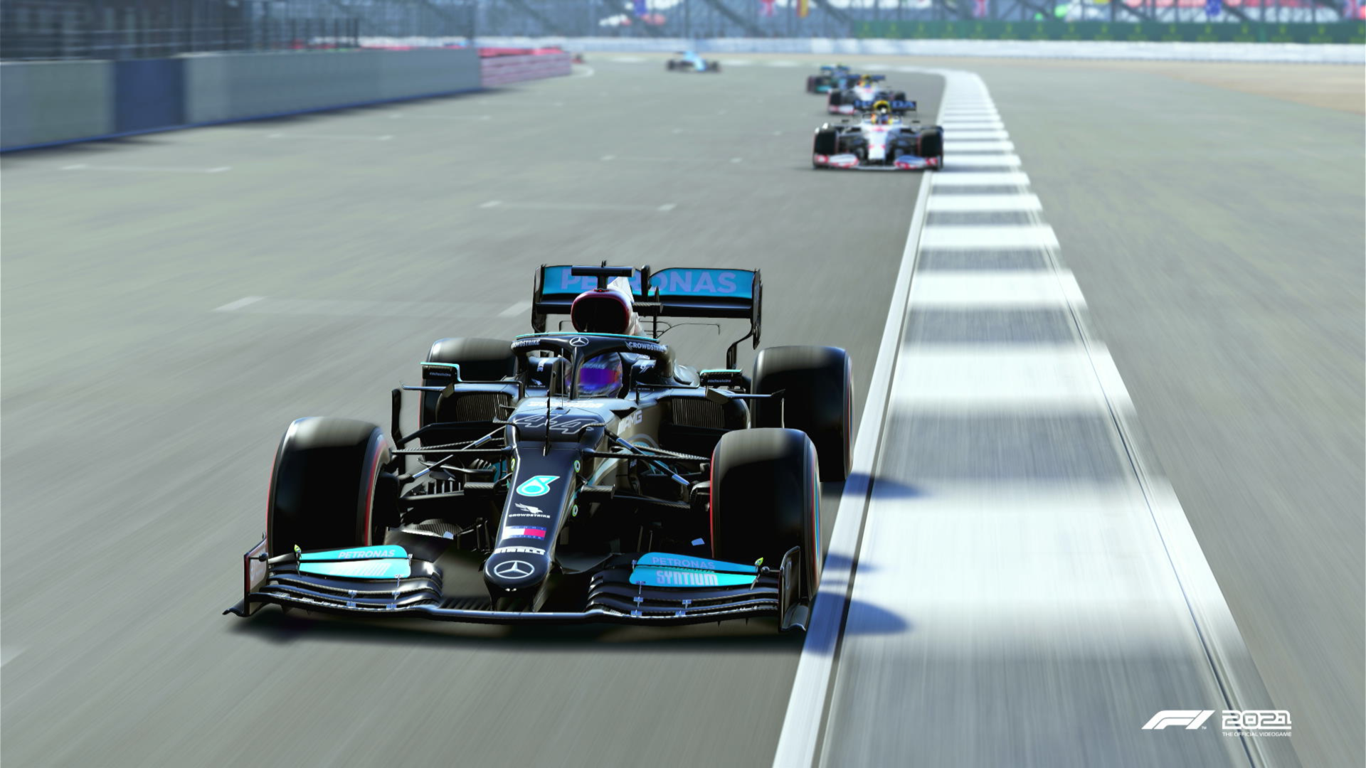 A group of F1 cards on the start/finish straight at the Singapore GP circuit. Shot in F1 2021 game. 