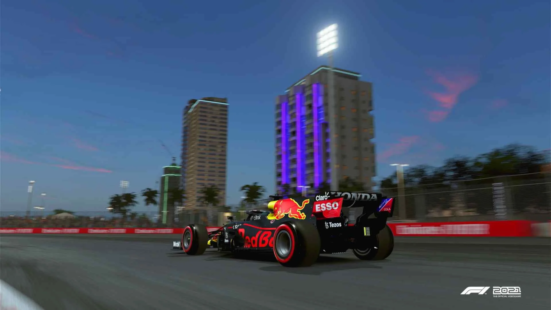 A group of F1 cards on the start/finish straight at the Singapore GP circuit. Shot in F1 2021 game. 