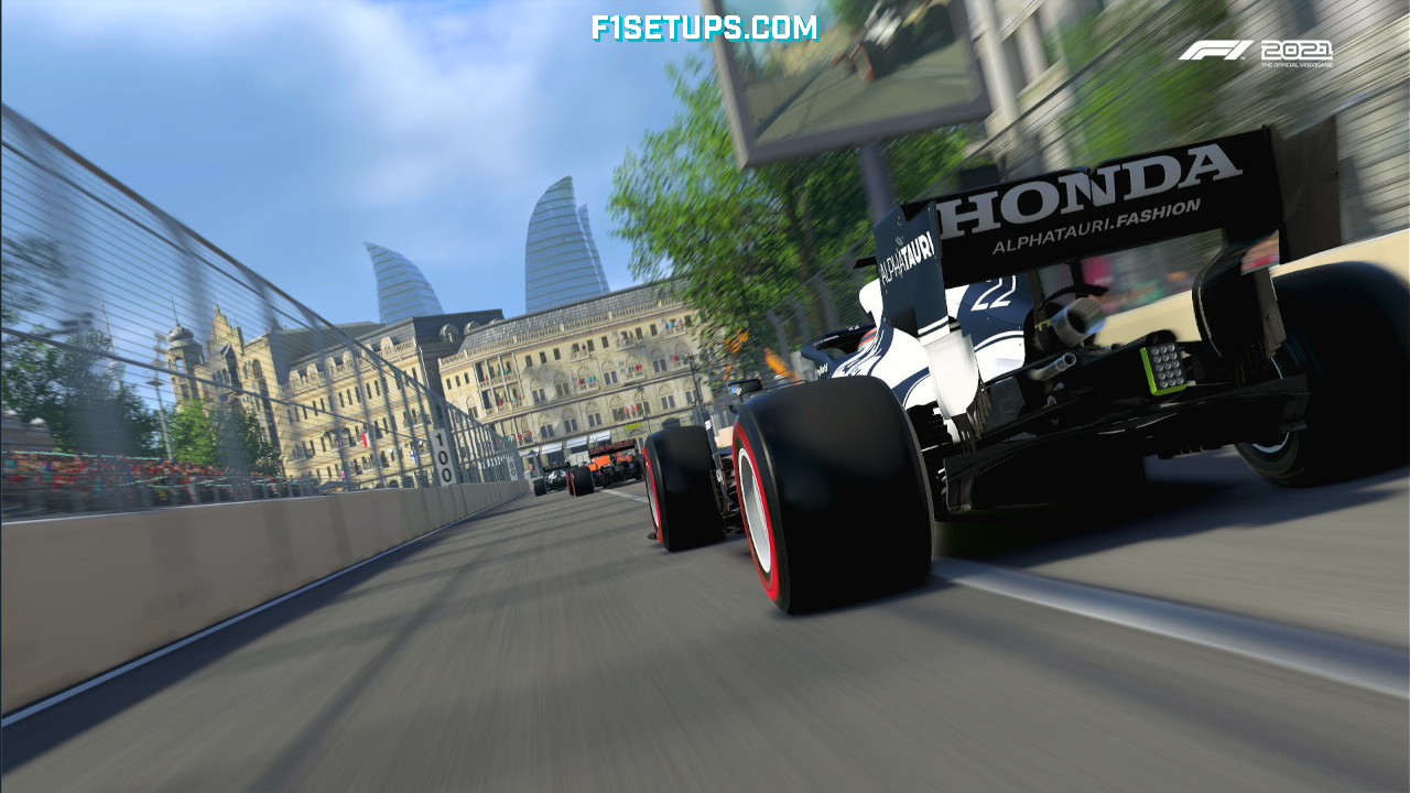 A group of F1 cards on the start/finish straight at the Singapore GP circuit. Shot in F1 2021 game. 