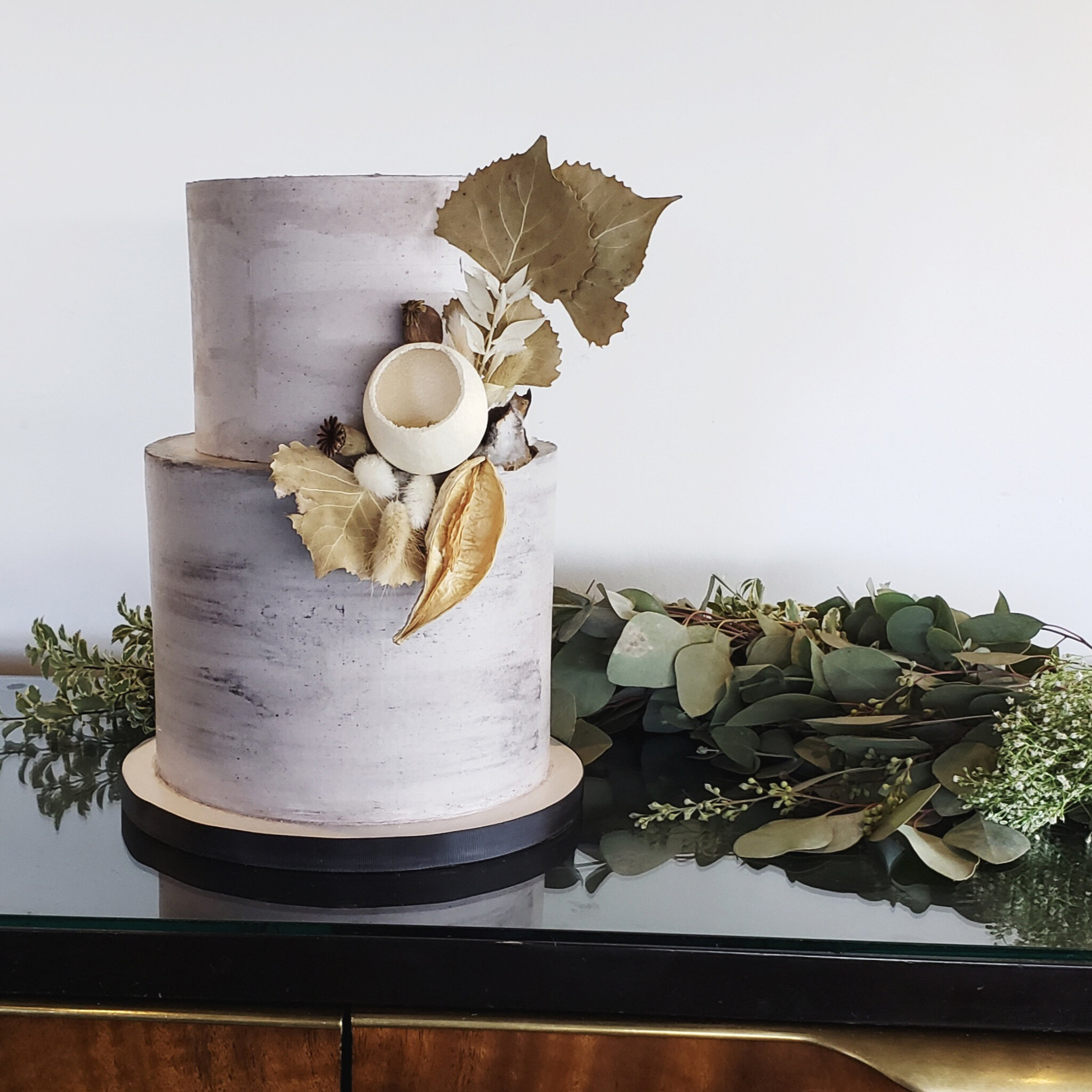 Concrete style buttercream wedding cake with seed pods fall foliage.jpg