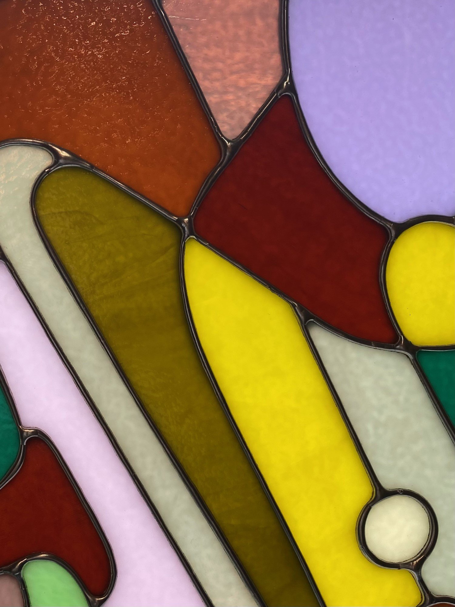 Abstract stained glass panel made by Ann Weinheimer in Wheat Ridge, Colorado.