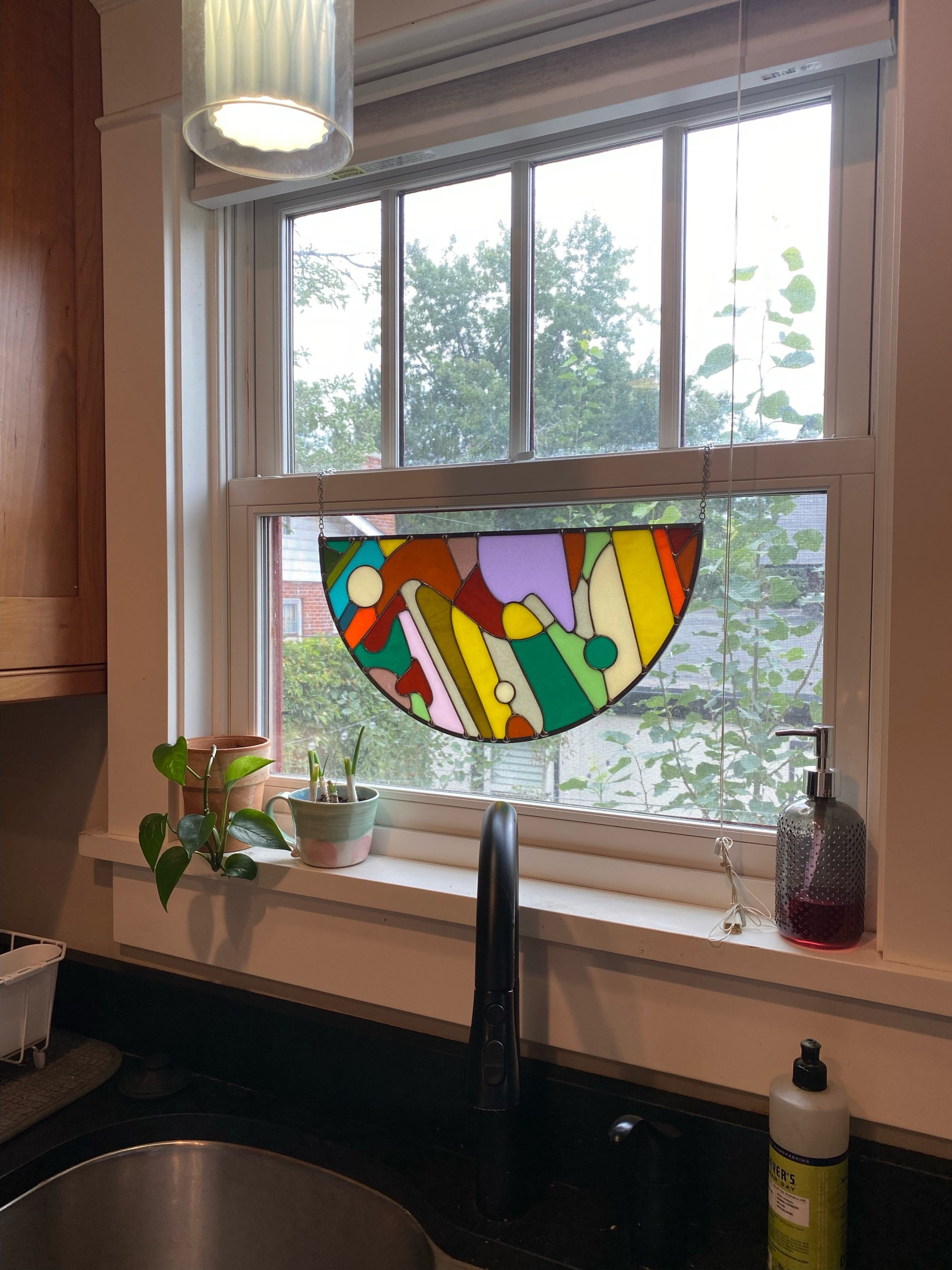 Abstract stained glass panel made by Ann Weinheimer in Wheat Ridge, Colorado.