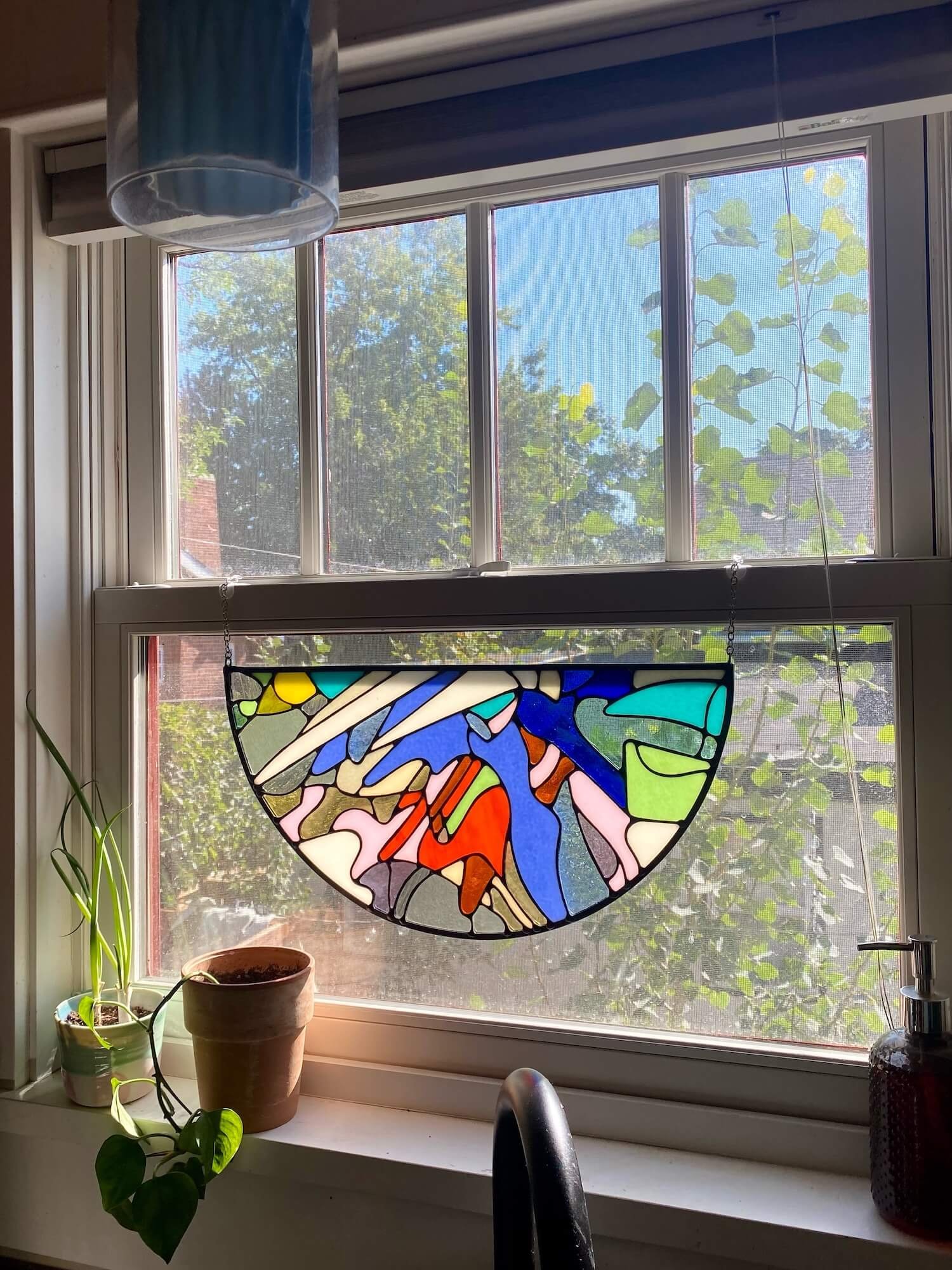 Abstract stained glass panel made by Ann Weinheimer in Wheat Ridge, Colorado.