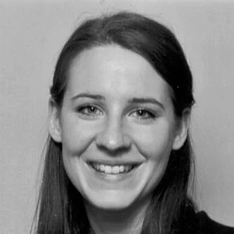 Smiling woman with long hair in black and white portrait