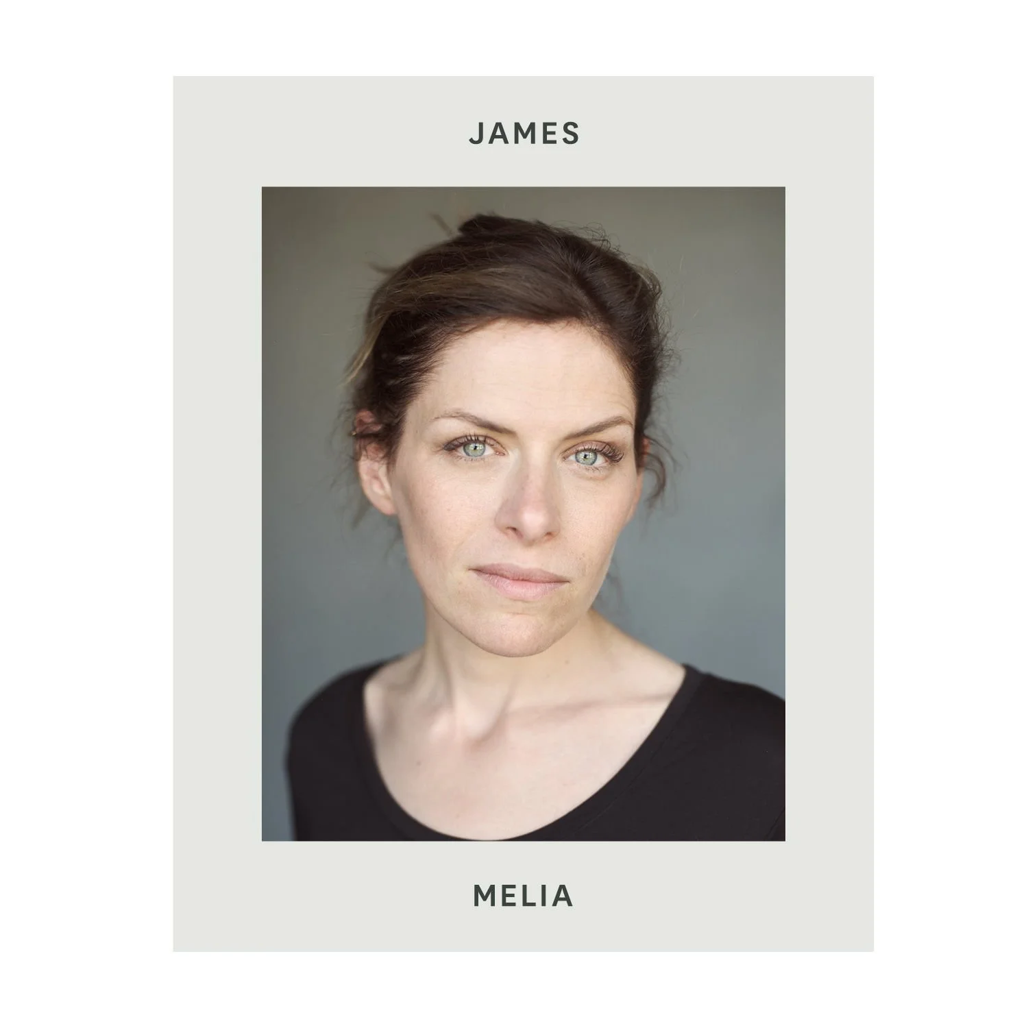 A woman with fair skin, short brown hair, and blue eyes wearing a black top, against a neutral background, with the name 'MELIA' at the bottom and 'JAMES' at the top of the image.