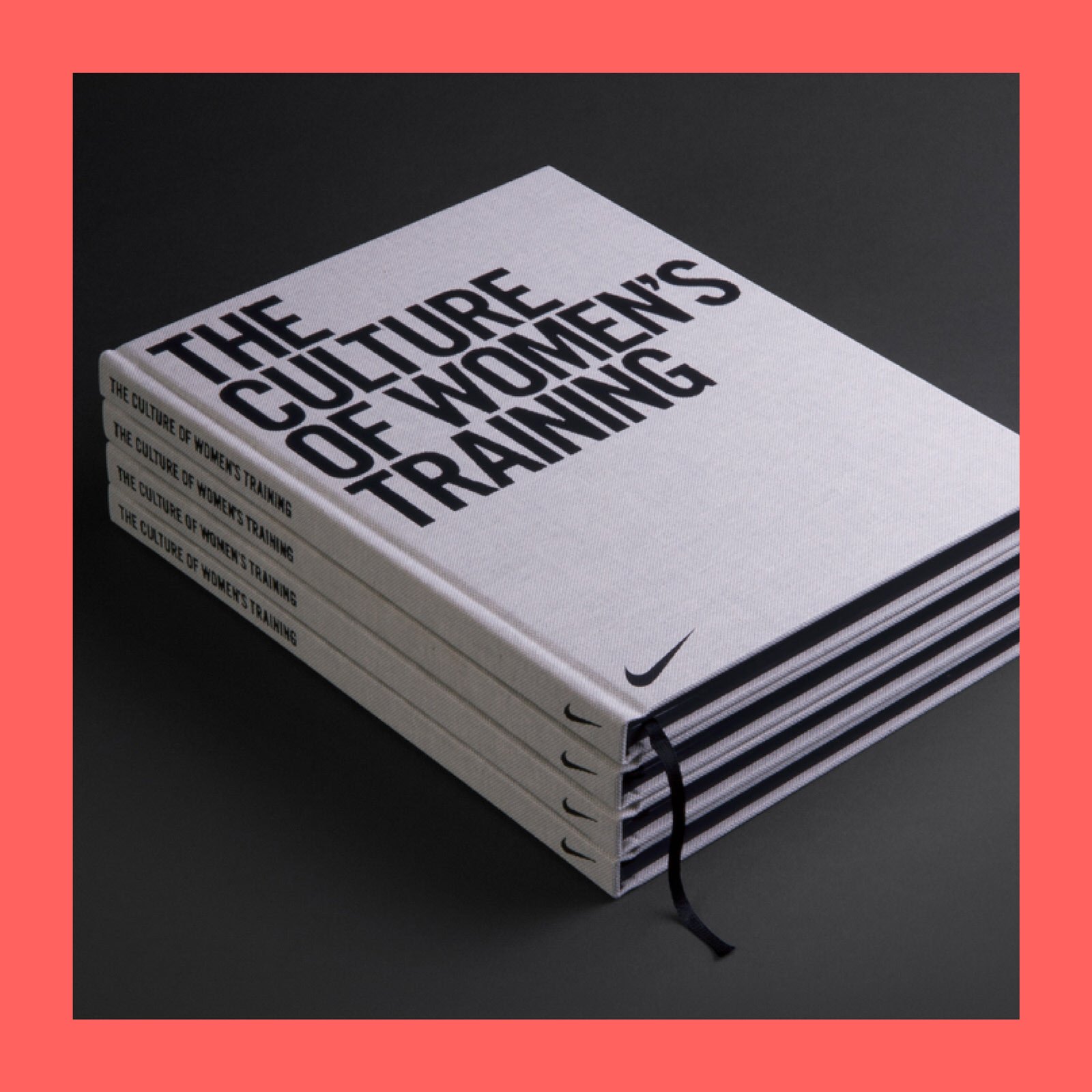 Stack of four white books titled 'The Culture of Women's Training' with a Nike swoosh logo on the bottom right, placed on a black background with a pink border.