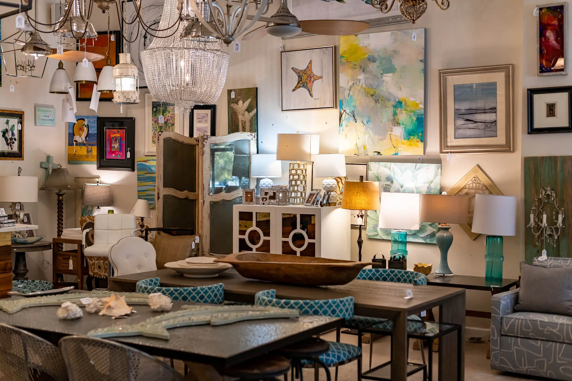 A furniture store displaying various lamps, artwork, and home decor items.