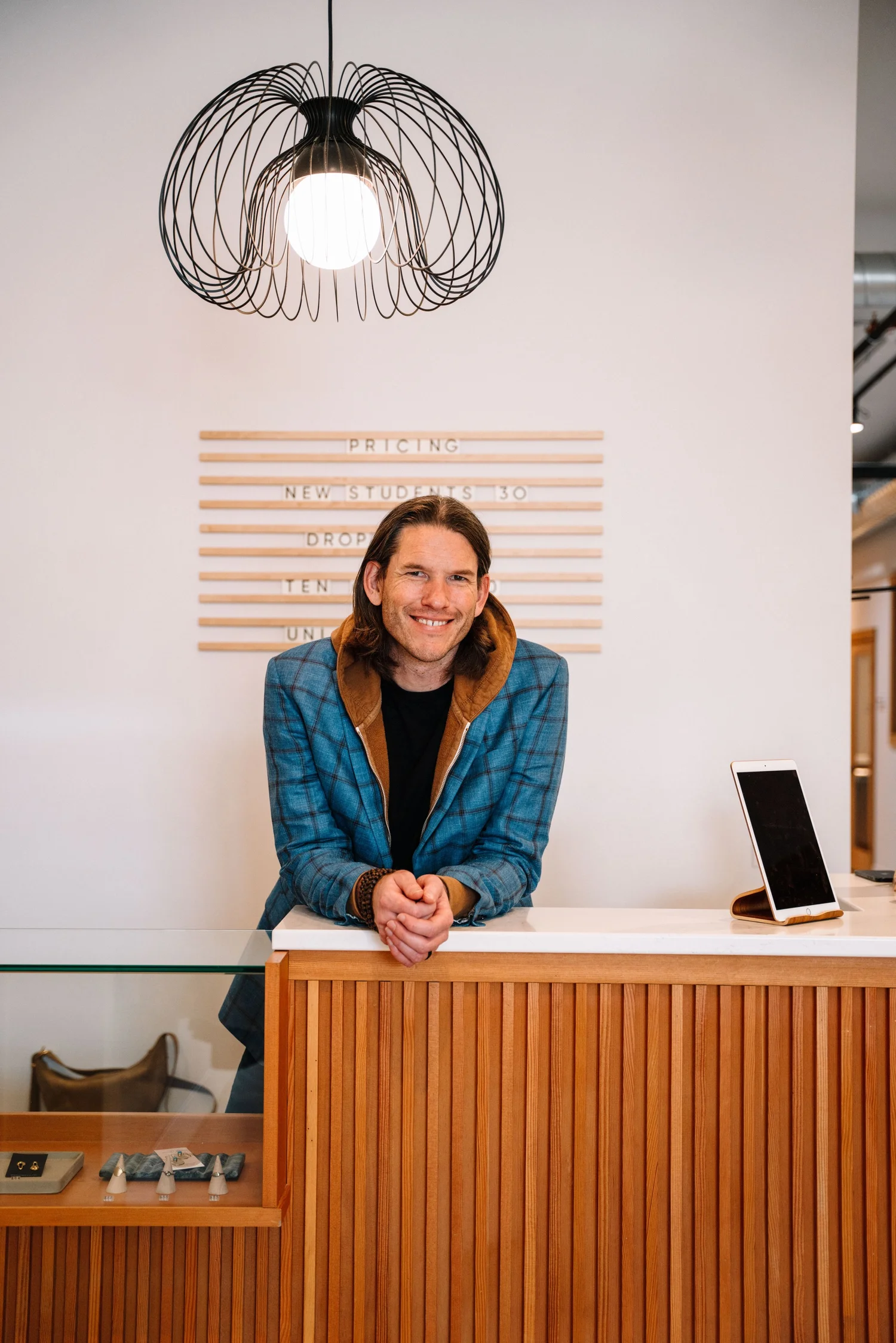 Kyle Kloostra at the front desk of Lynden Yoga Collective