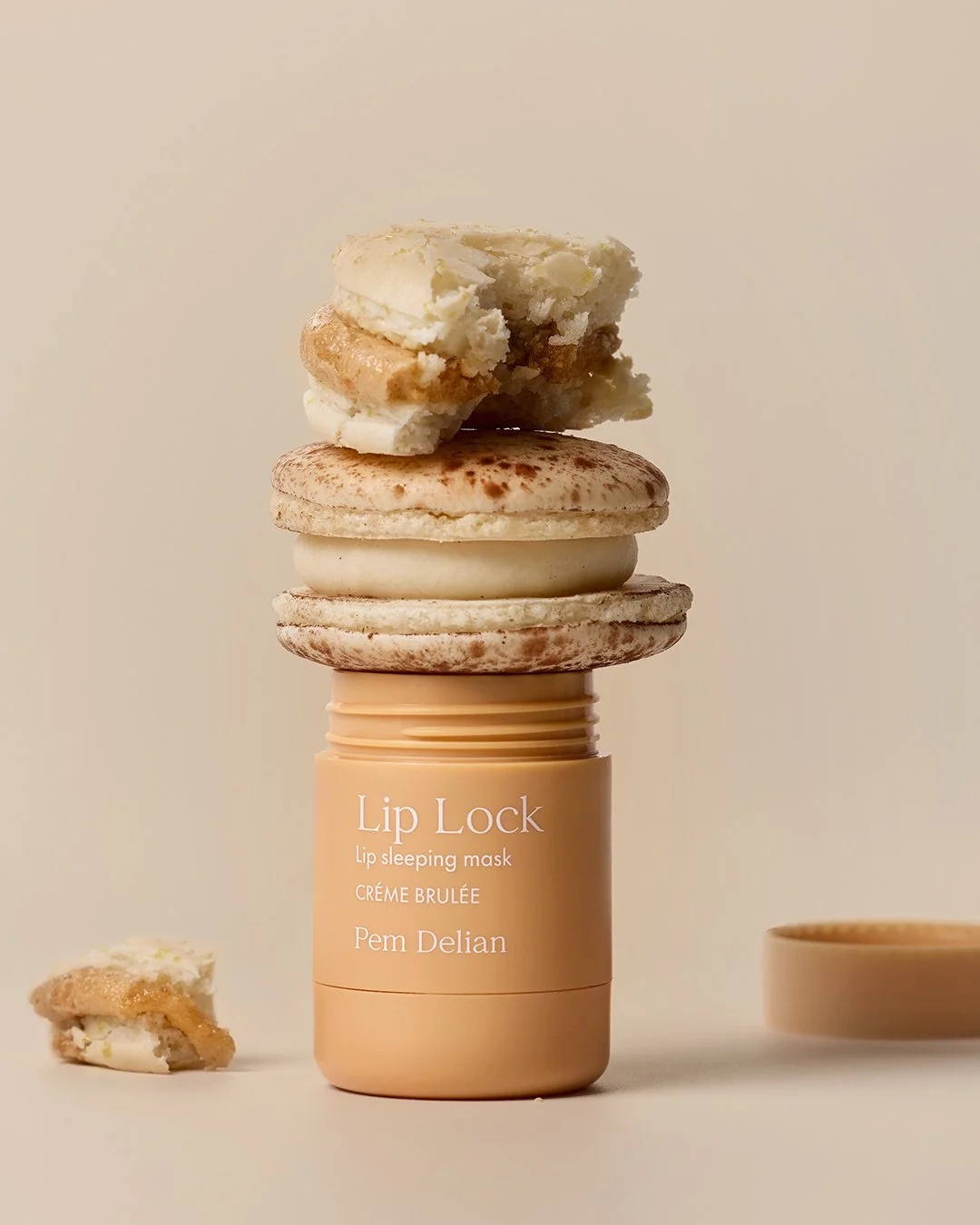 Pem Delian Lip Lock Créme Brulée lip sleeping mask jar styled with crème brûlée macarons.