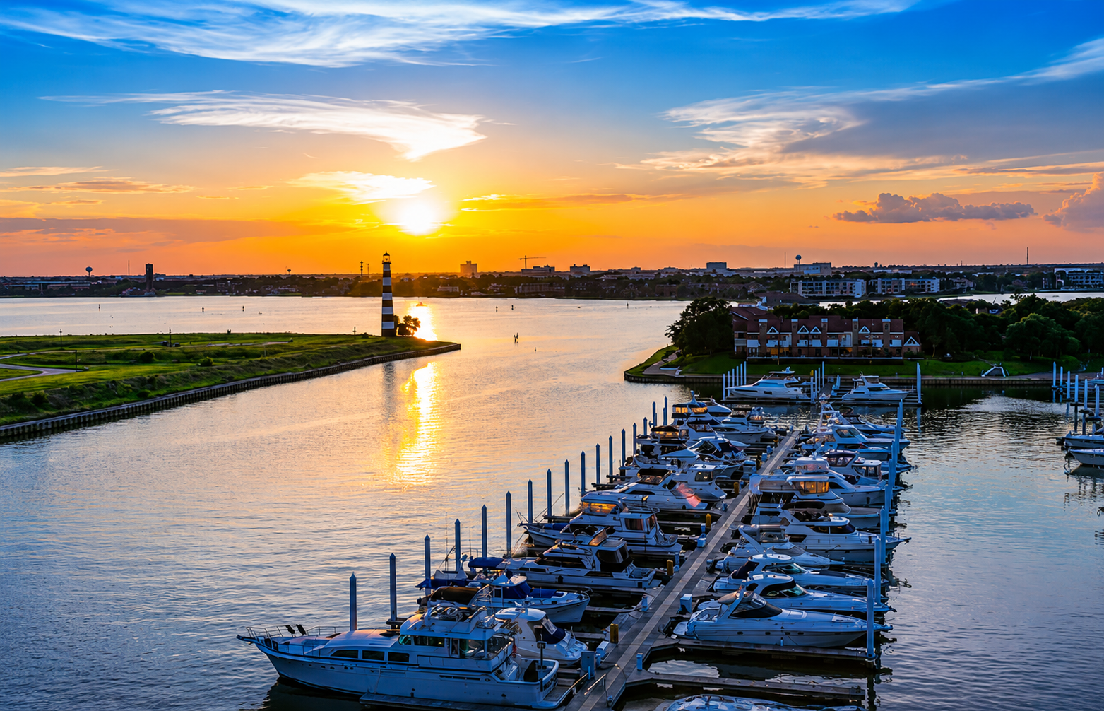 Sunset over the Clear Lake Shores marina in Bay Area Houston, reflecting the relaxed coastal lifestyle that inspires Amy Baez Interiors' timeless residential designs.