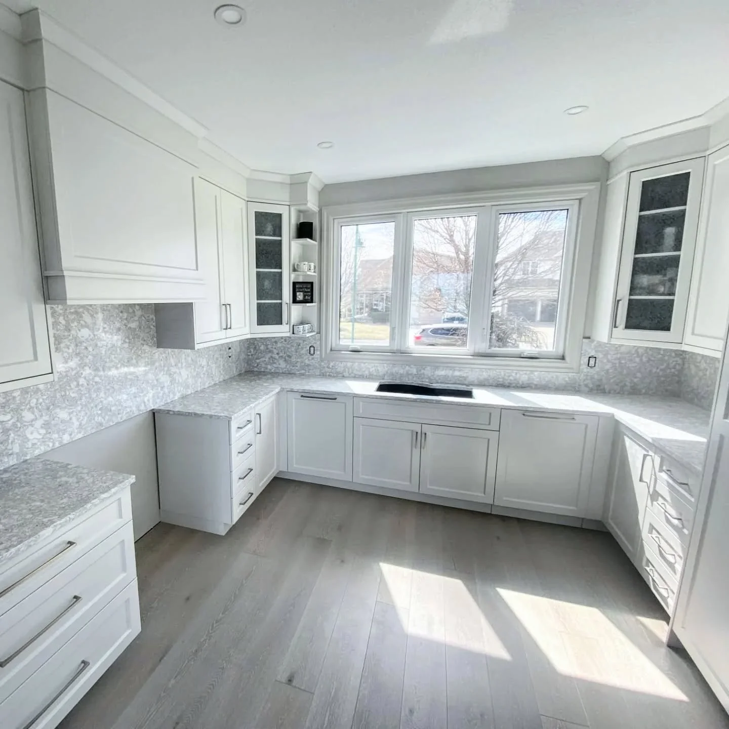 Character is great, but there&rsquo;s something about a crisp white palette that feels like a deep breath. These quartz tops feature subtle warm undertones that soften the space without losing that clean, modern edge.

A full-height backsplash elimin