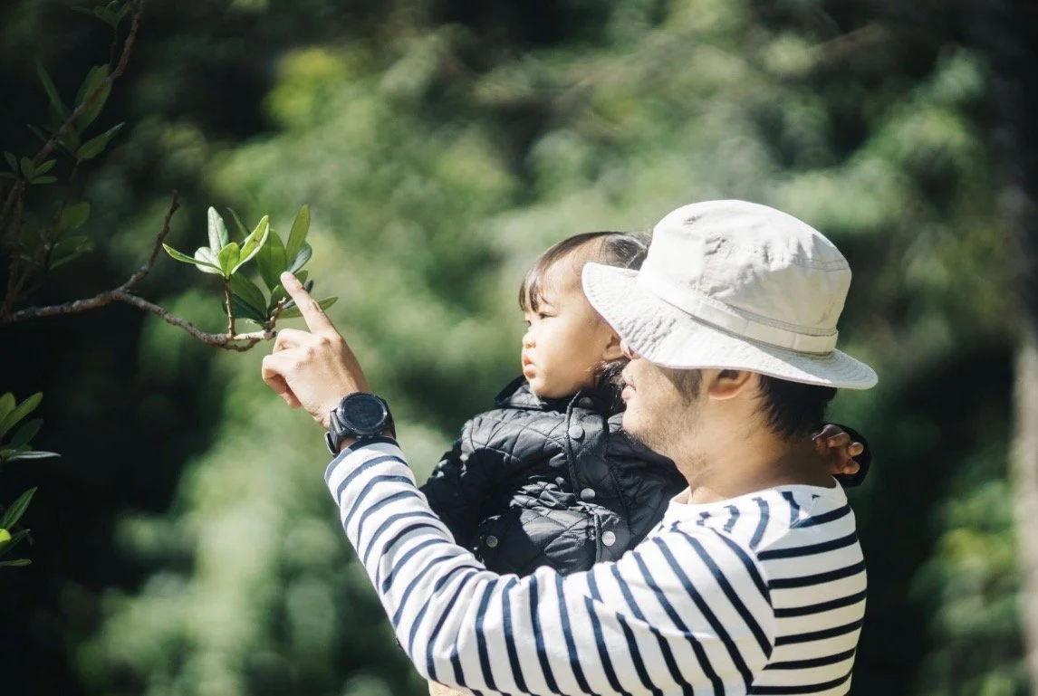 A young child exploring outdoors