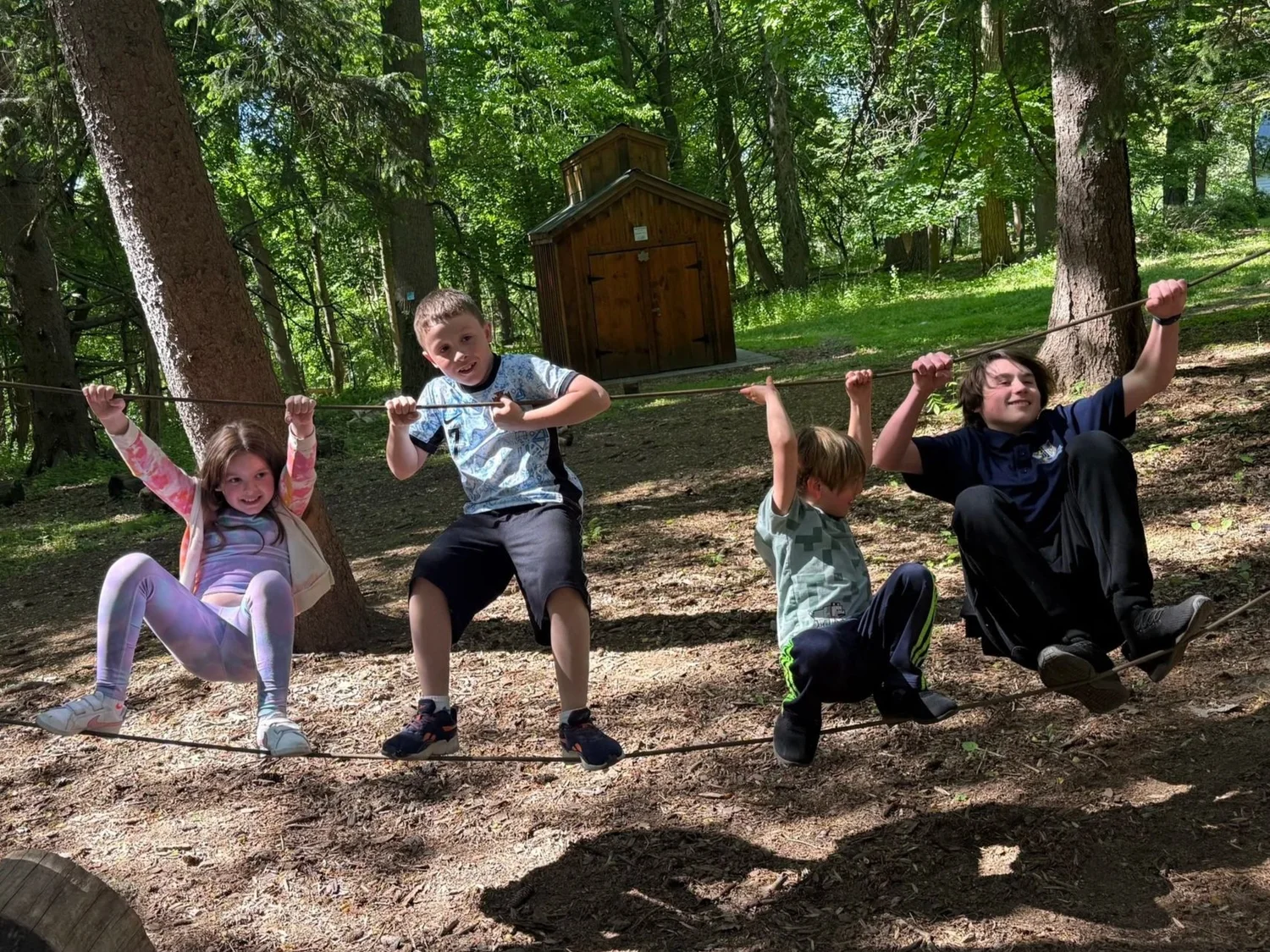 Children gathered together in the woods