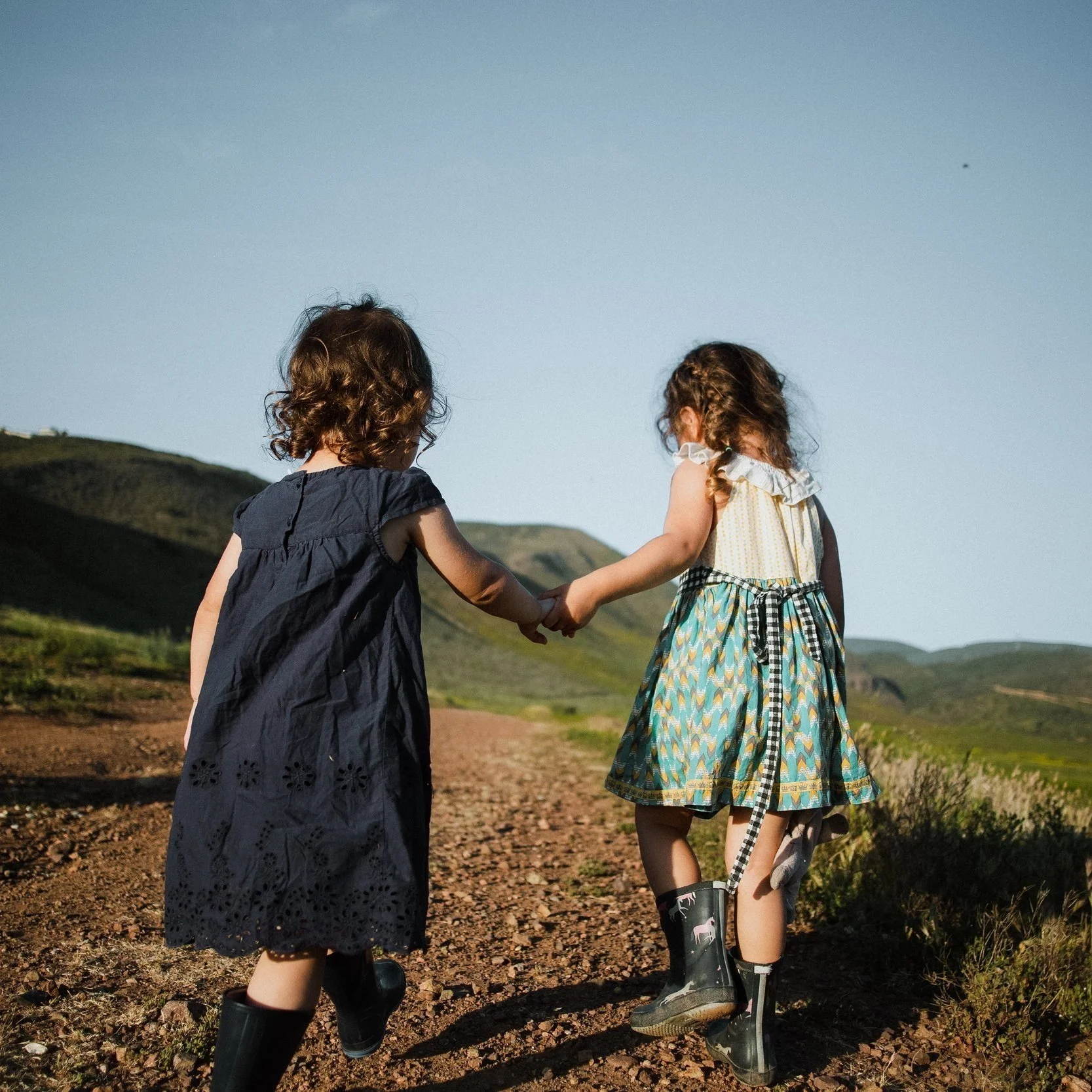 toddlers walking next to their nanny in Snohomish County