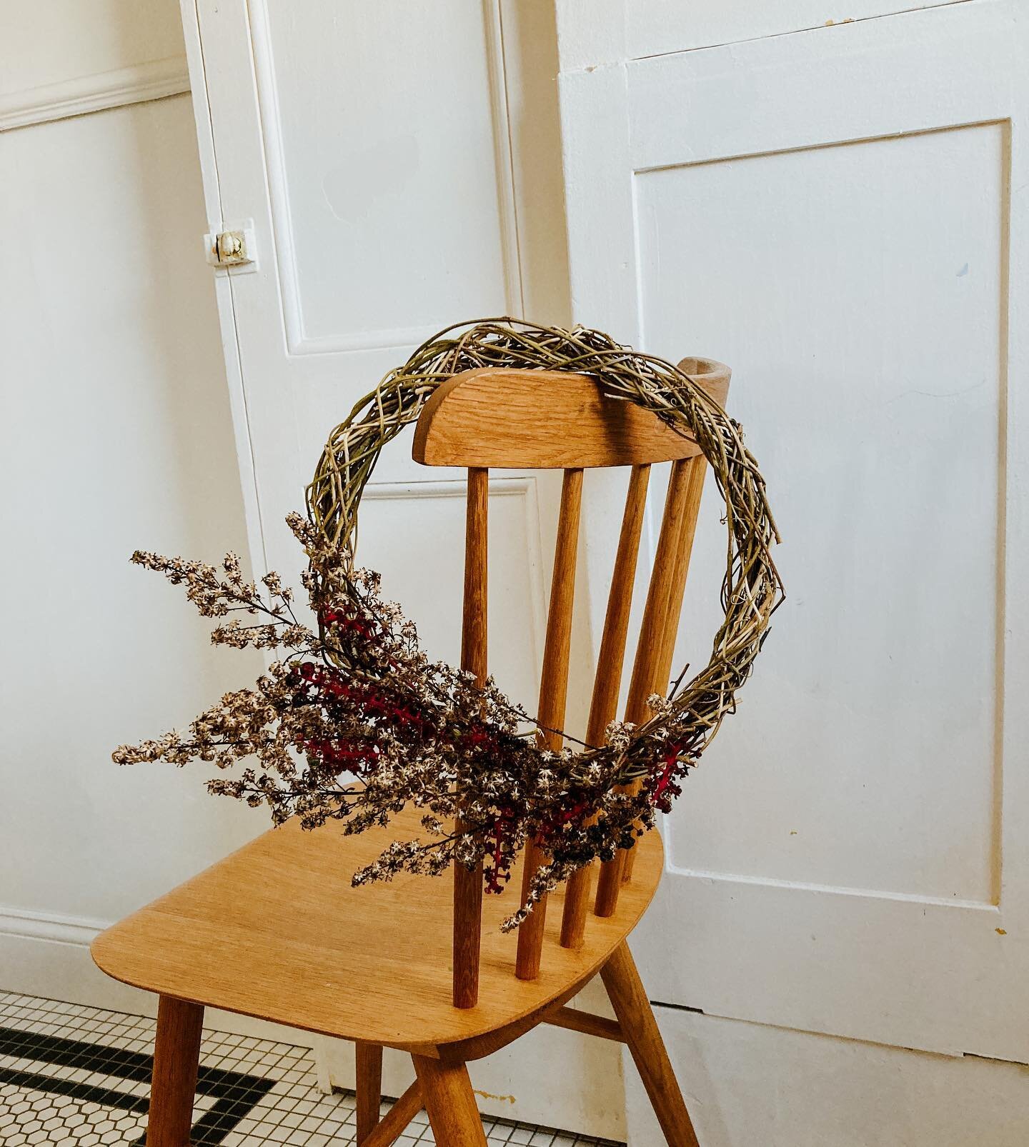 A little goldenrod and pokeweed berry wreath. Native plants the color of cranberries and stuffing. I spent the summer pulling out stray vines around our yard and twisted together the frame just to make shaggy messes like this.