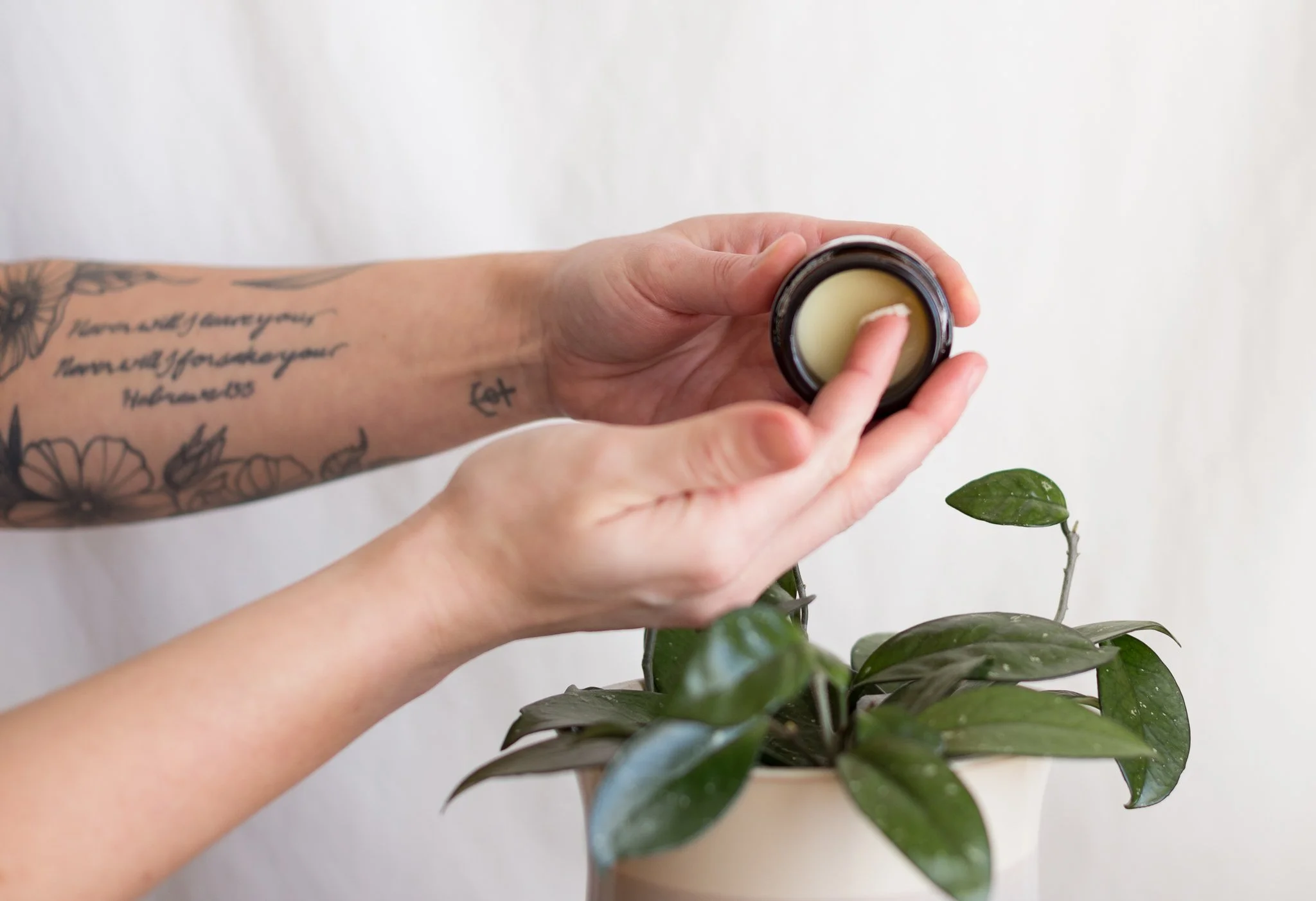 A pea-sized amount of pork tallow balm on a fingertip