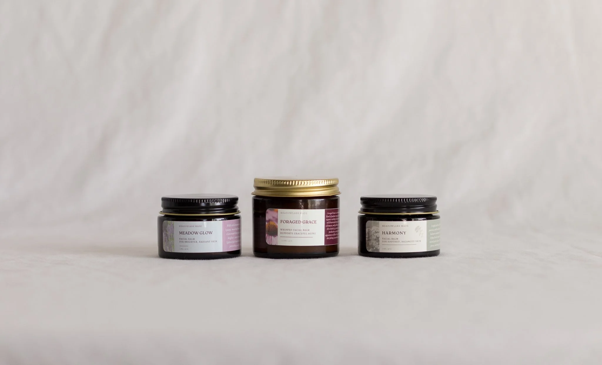 Handcrafted herbal infused tallow facial balms for every day use by Meadowlark Made