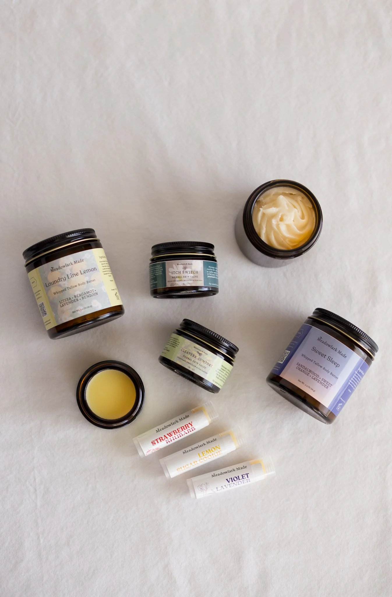Meadowlark Made's handcrafted Spring Collection captures that seasonal prairie freshness with soft citrus body butters, nostalgic lip balm flavors, and small-batch herbal salves formulated for springtime rituals.