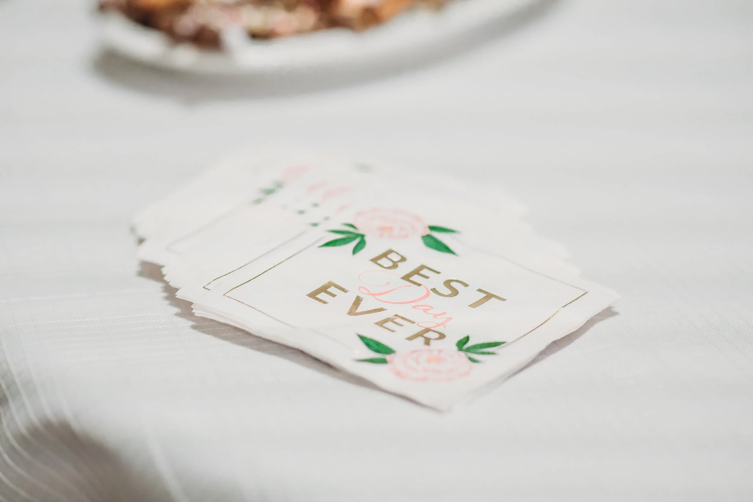 Wedding or celebration napkin with floral design and the text "Best Day Ever".